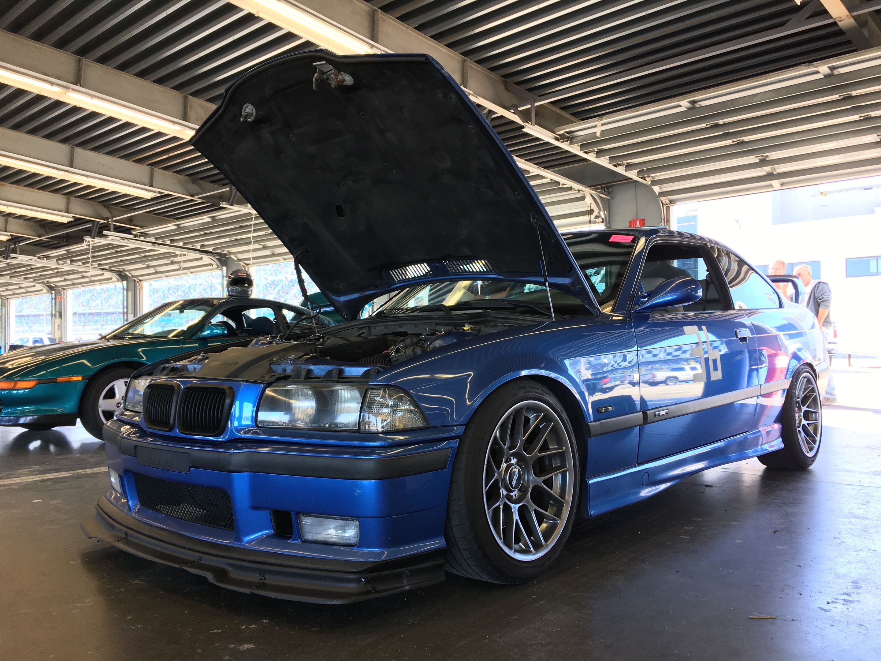 Blue BMW E36 M3 with 17" ARC-8 Apex wheels in Hyper Black