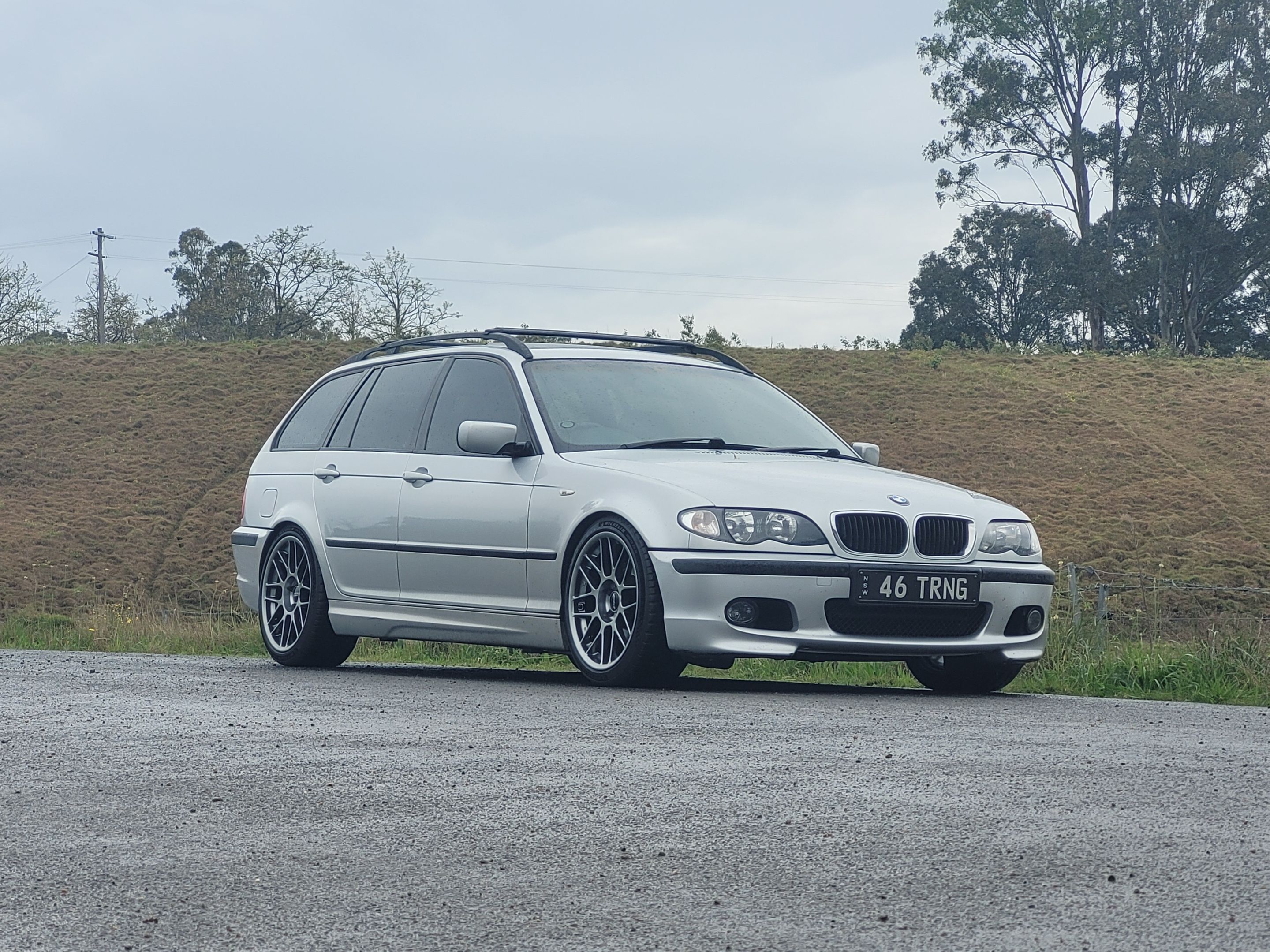 Silver BMW E46 3 Series with 18" ARC-8 Apex wheels in Hyper Black