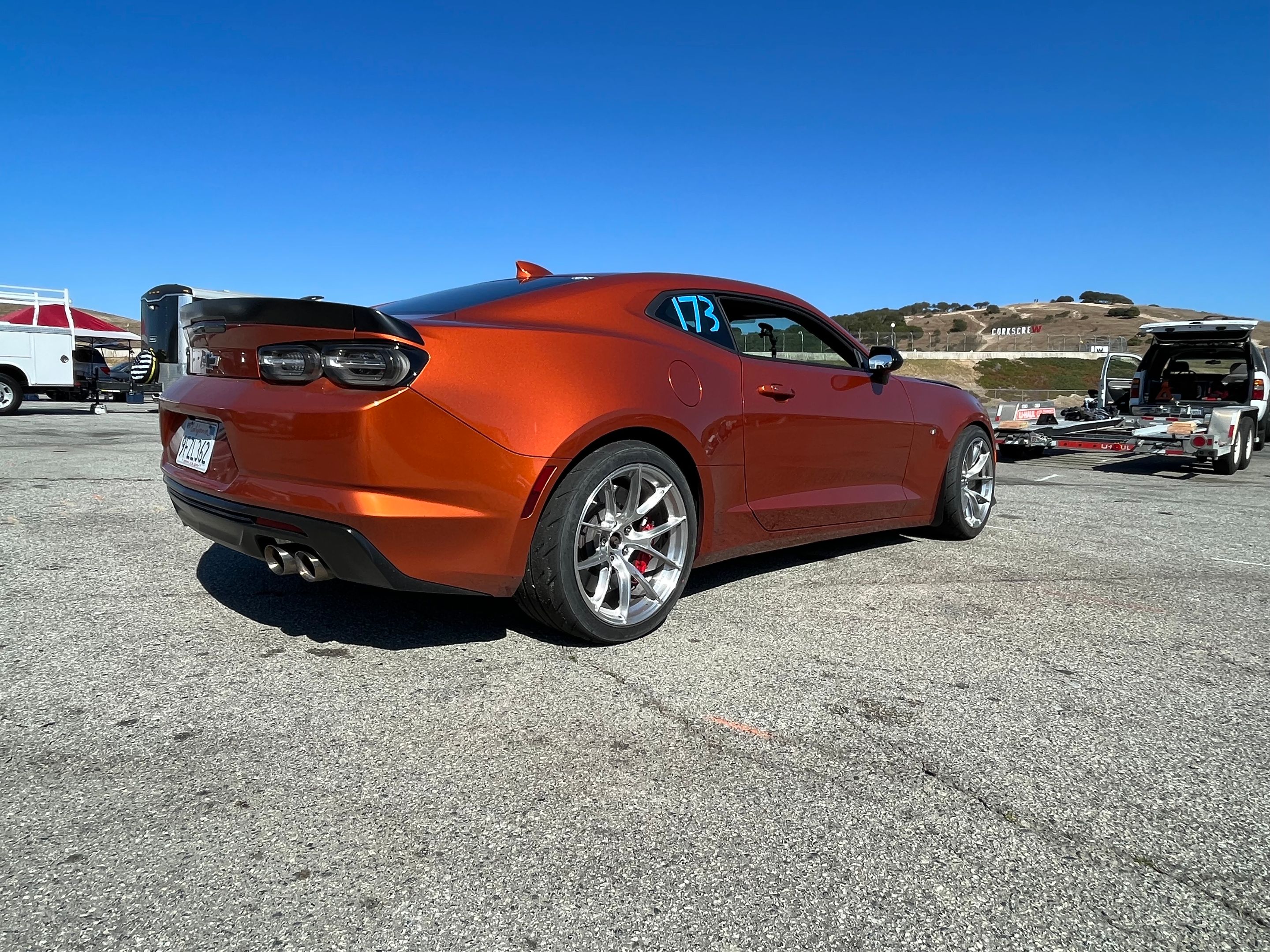 Orange Chevrolet 6th Gen Camaro SS 1LE with 19" VS-5RS Apex wheels in Brushed Clear