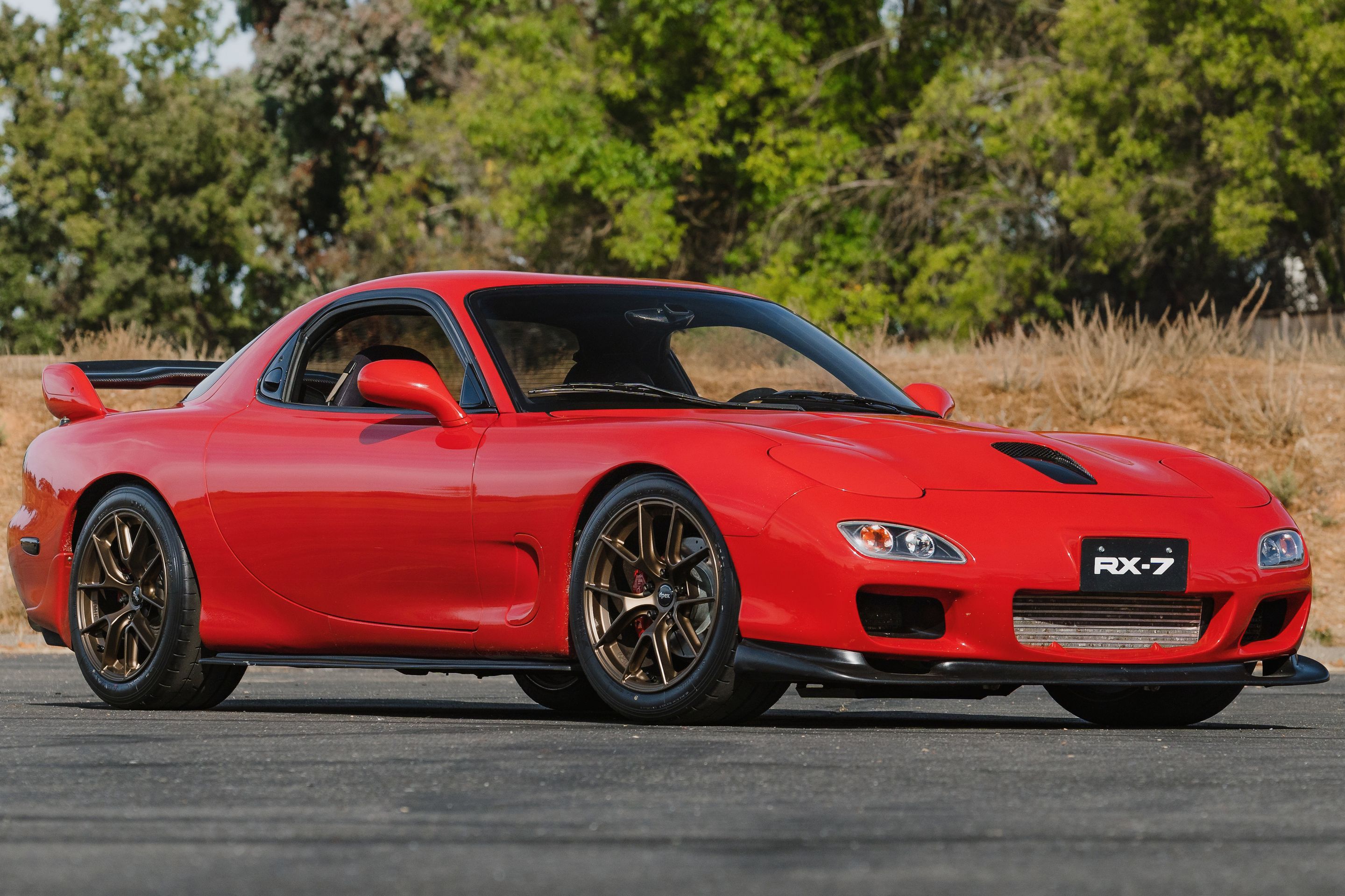 Red Mazda FD RX-7 with 17" VS-5RS Apex wheels in Satin Bronze