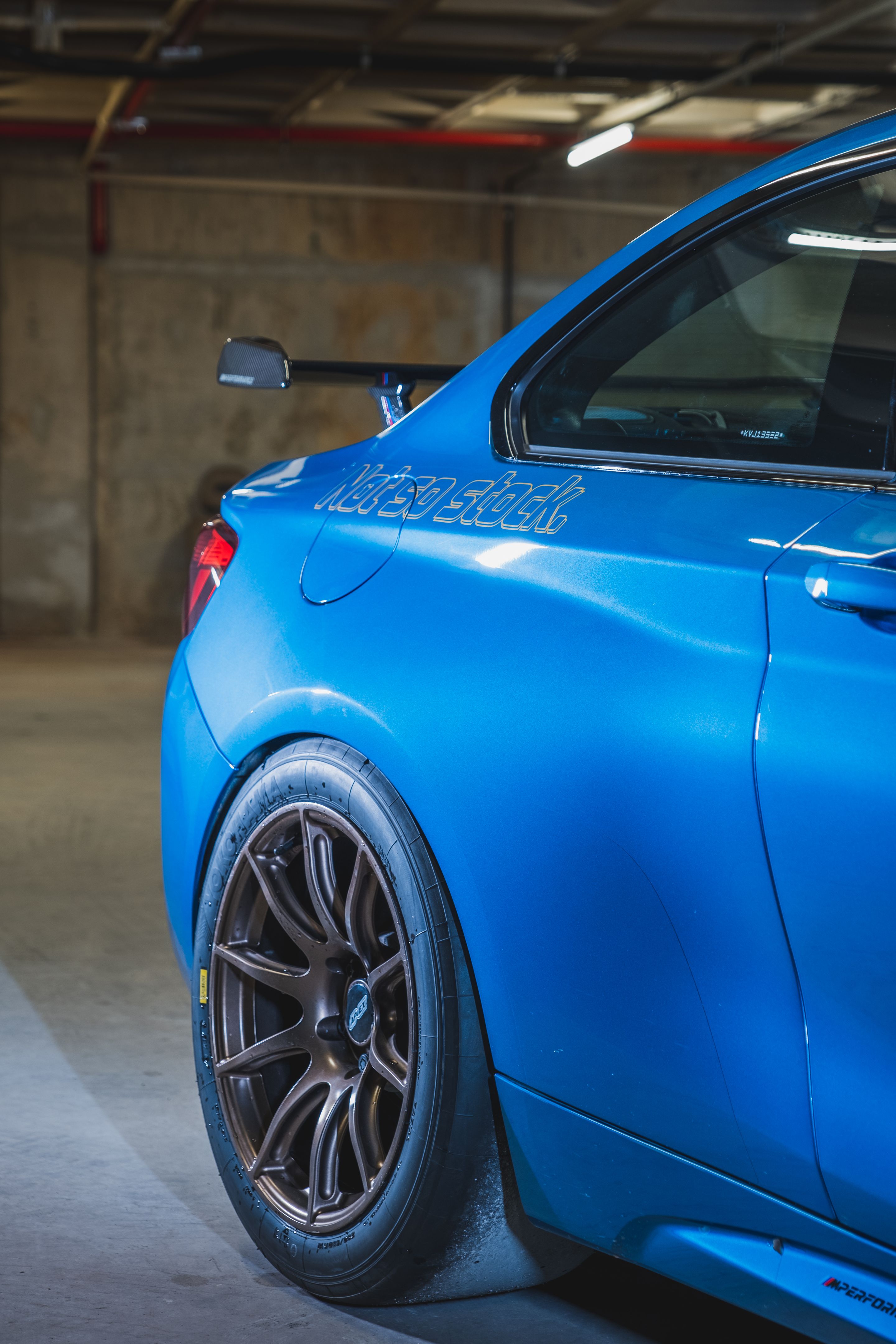Blue BMW F87 M2 with 18" SM-10 Apex wheels in Custom Finish