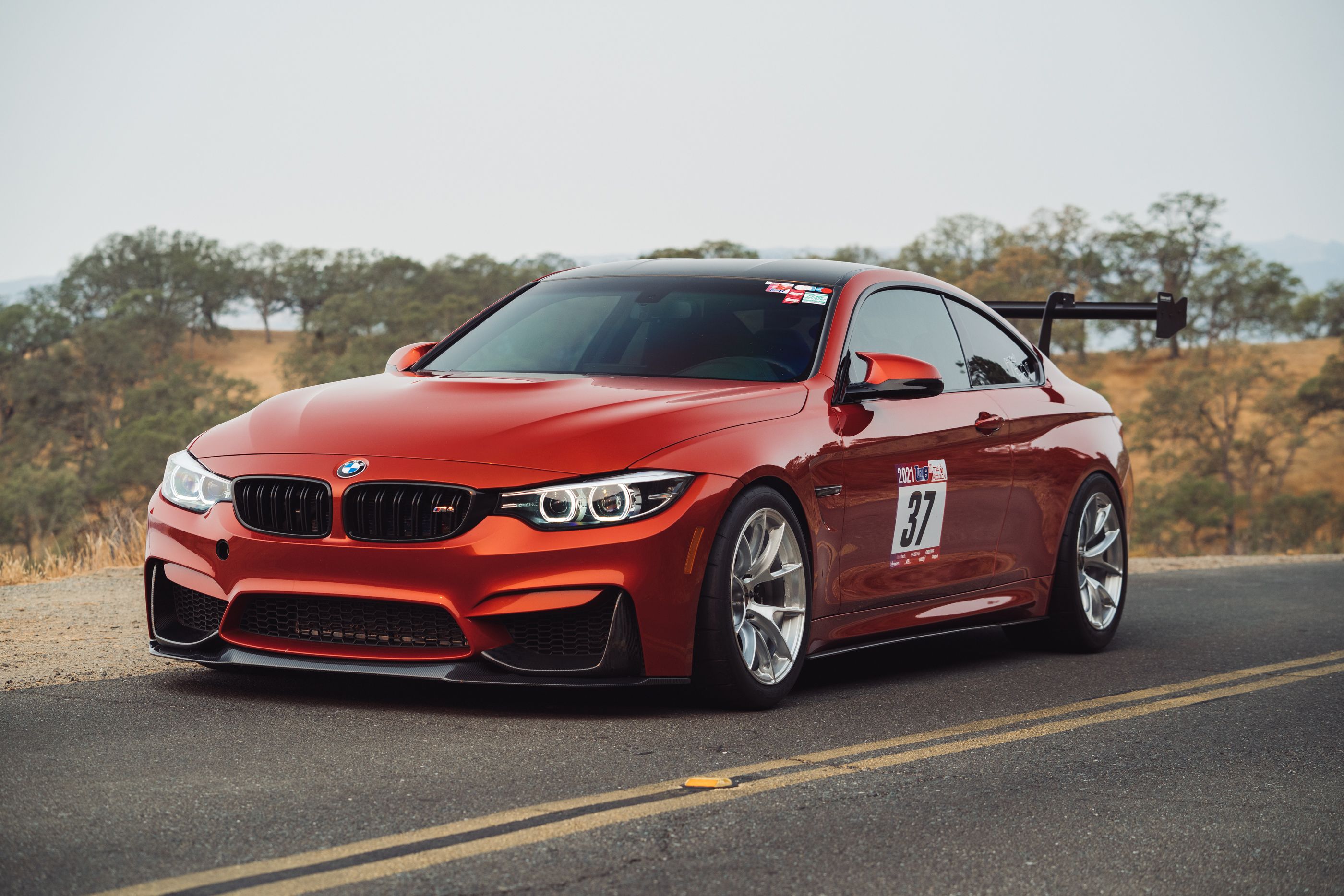 Orange BMW F82 Coupe M4 with 18" VS-5RS Apex wheels in Brushed Clear