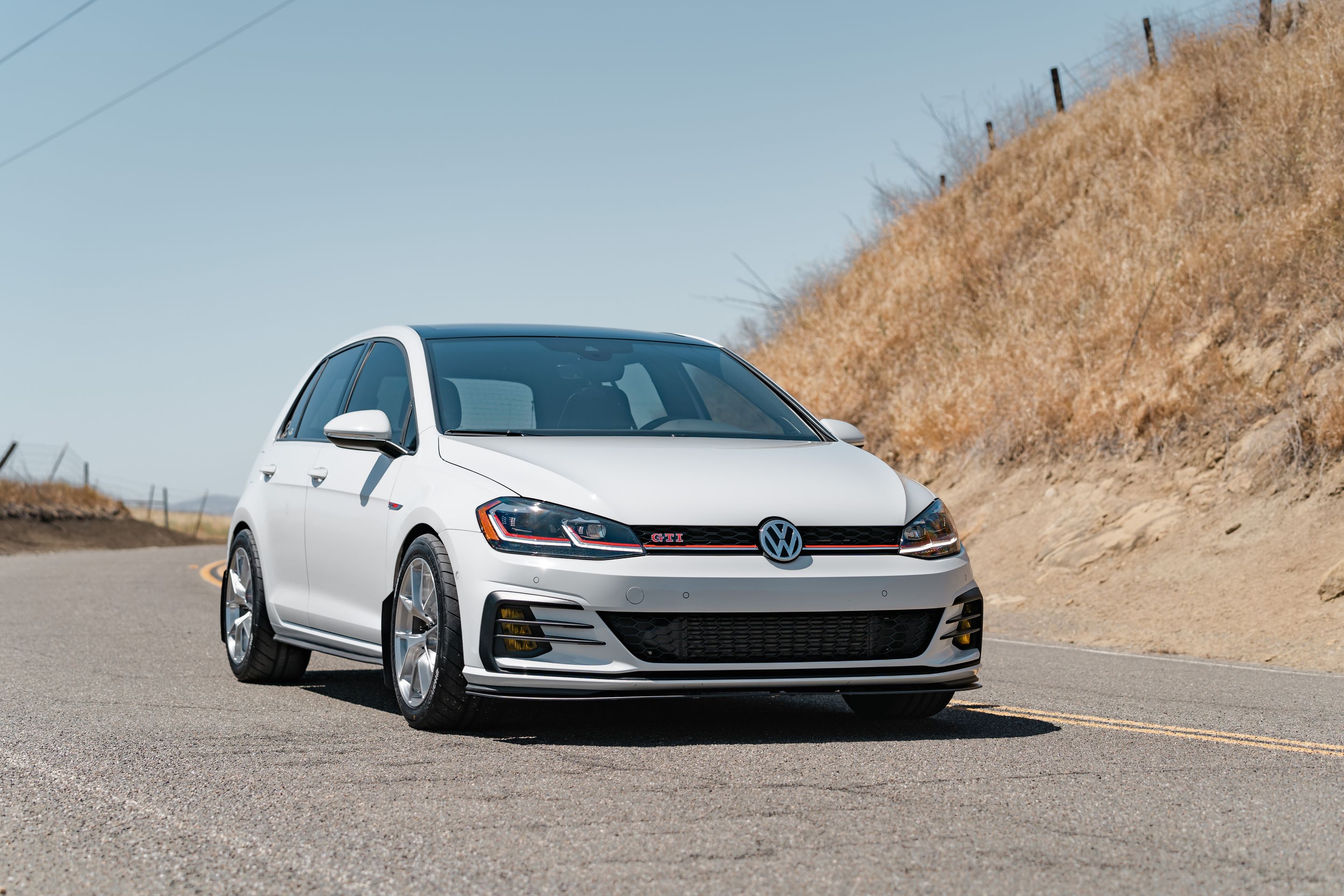 White VW MK7 GTI with 17" VS-5RS Apex wheels in Brushed Clear