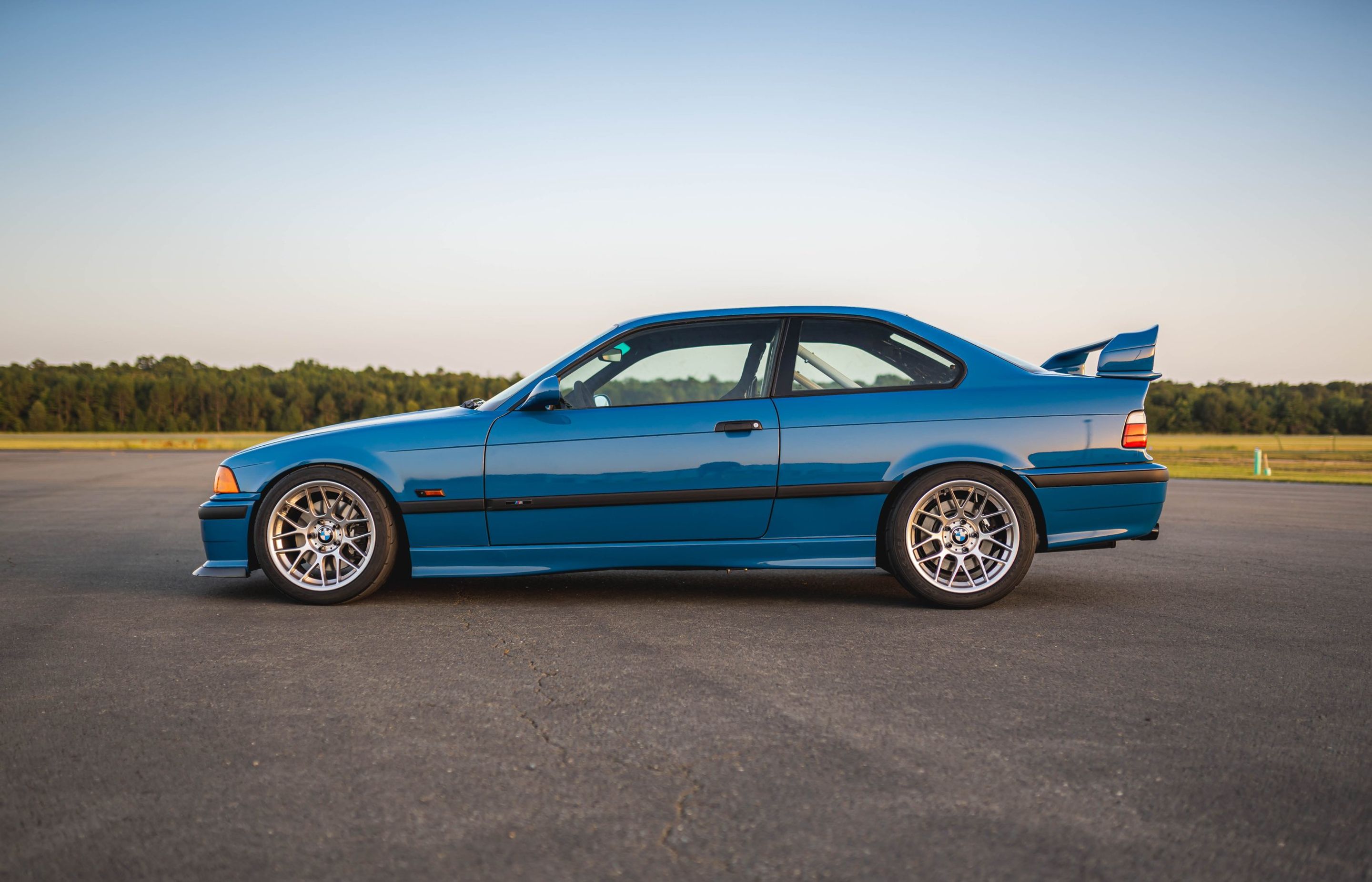 Blue BMW E36 M3 with 17" ARC-8 Apex wheels in Hyper Silver
