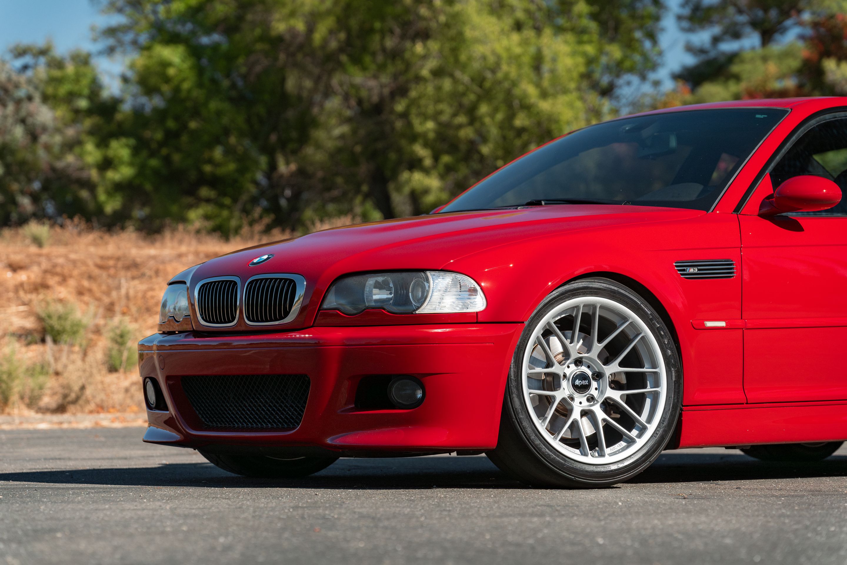 Red BMW E46 M3 with 18" ARC-8RT Apex wheels in Race Silver