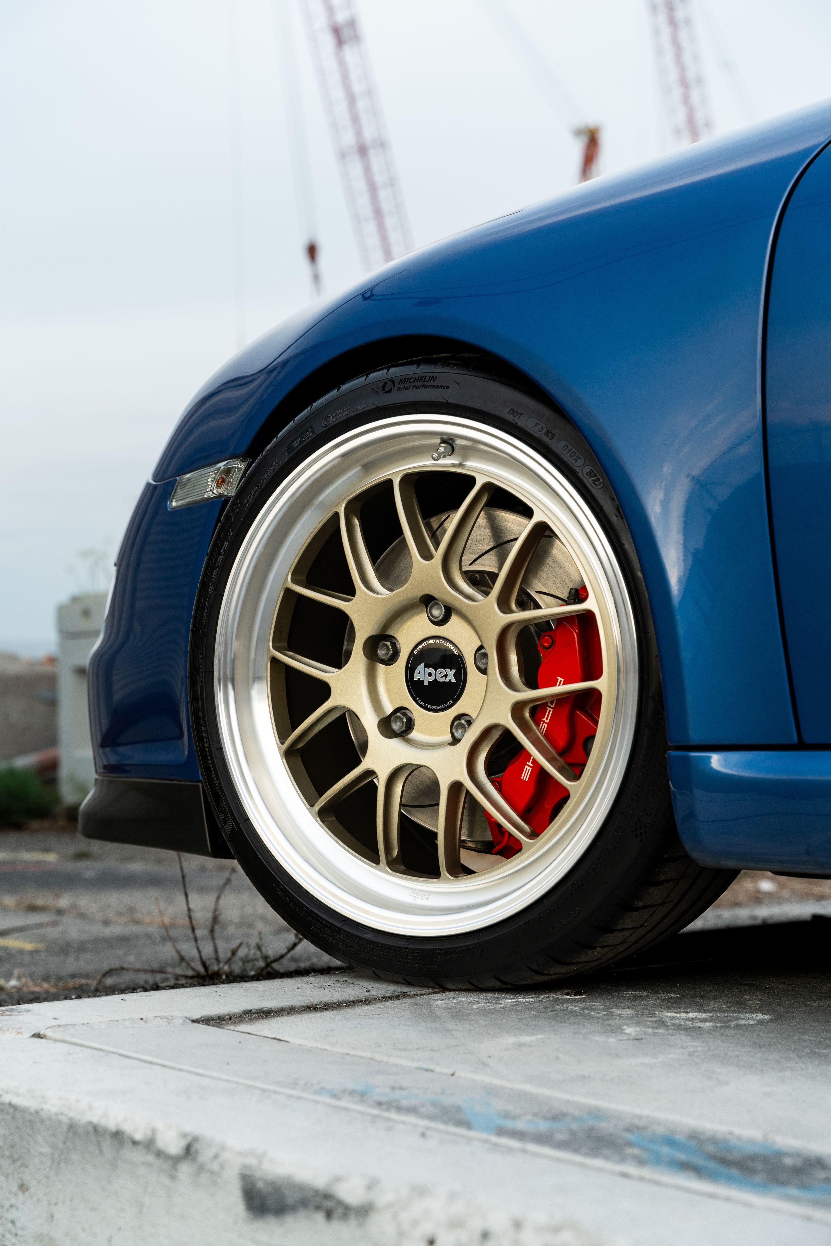 Blue Porsche 911 997 GT3 with 19" TEST-M Apex wheels in Machined Lip Gloss Motorsport Gold