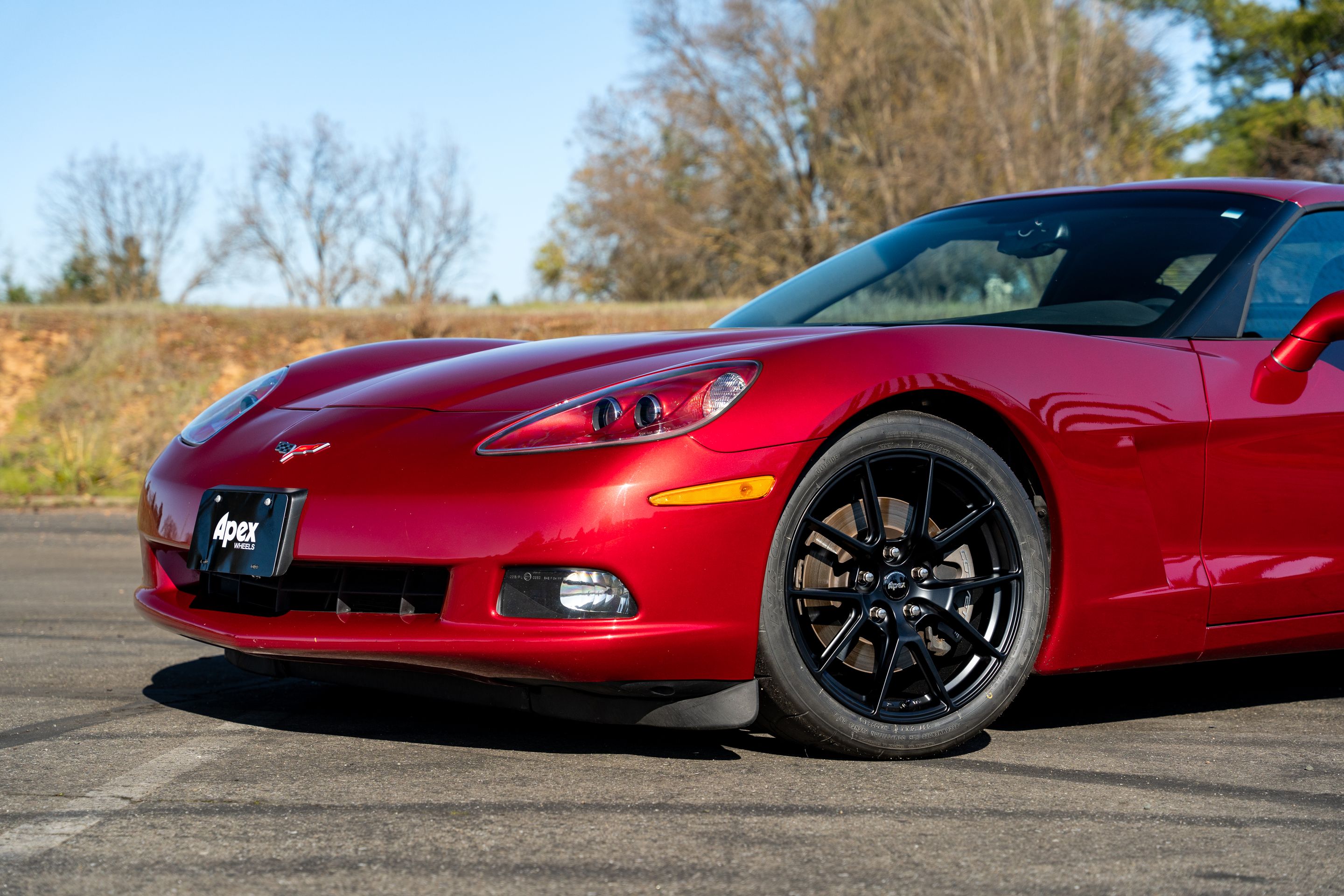 Red Chevrolet C6 Corvette Base/Z51 with 18" VS-5 Apex wheels in Satin Black