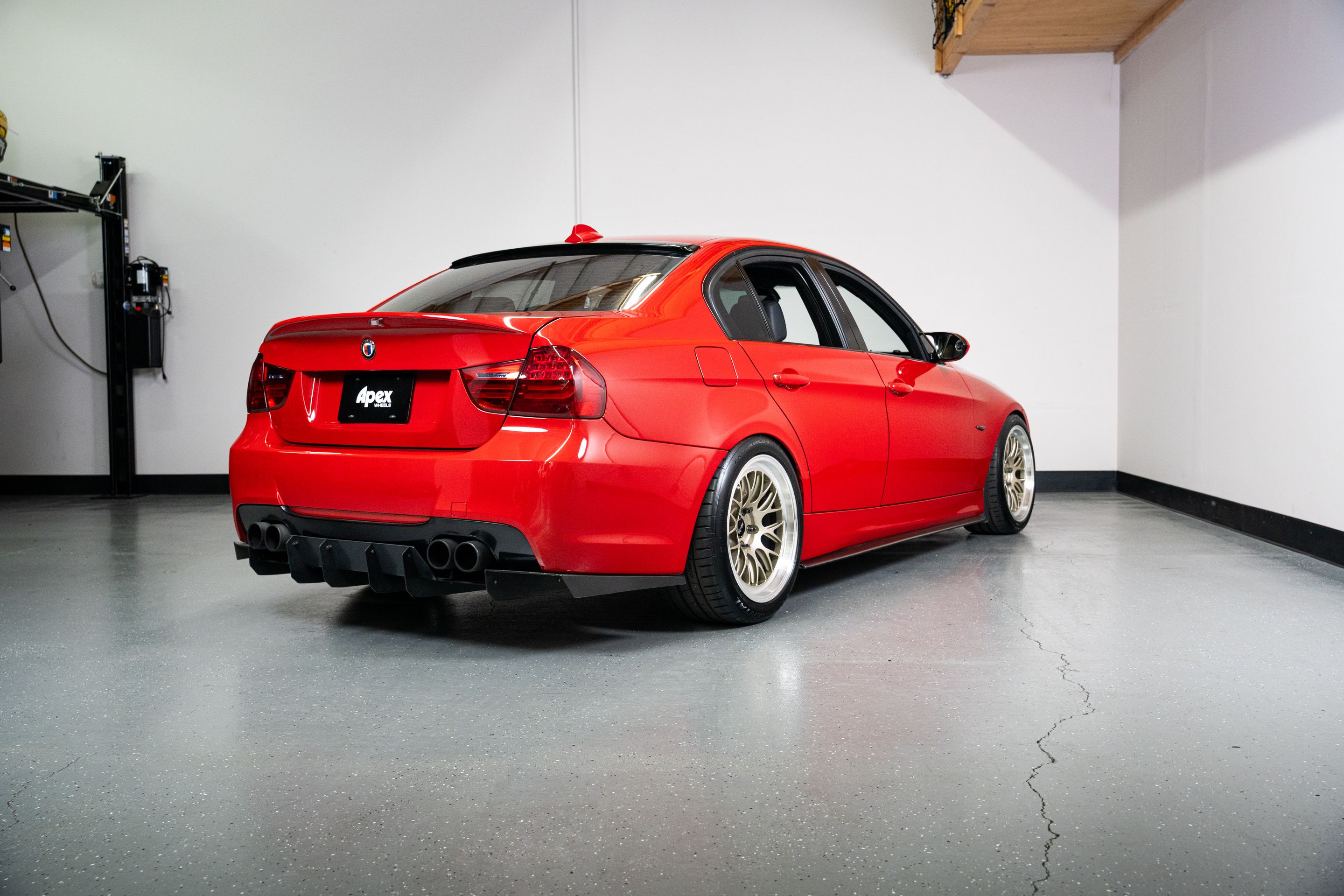 Red BMW E90 Sedan 3 Series with 18" ML-10RT Apex wheels in Machined Lip Gloss Motorsport Gold