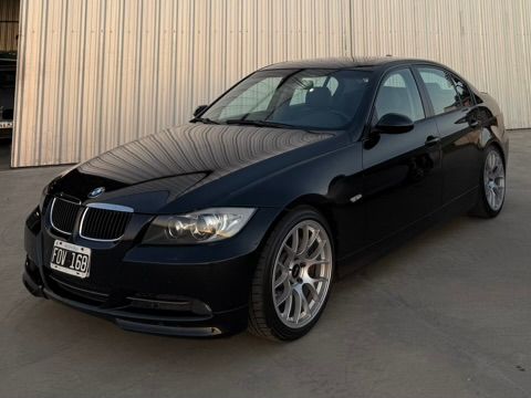 Black BMW E90 Sedan 3 Series with 18" EC-7 Apex wheels in Race Silver