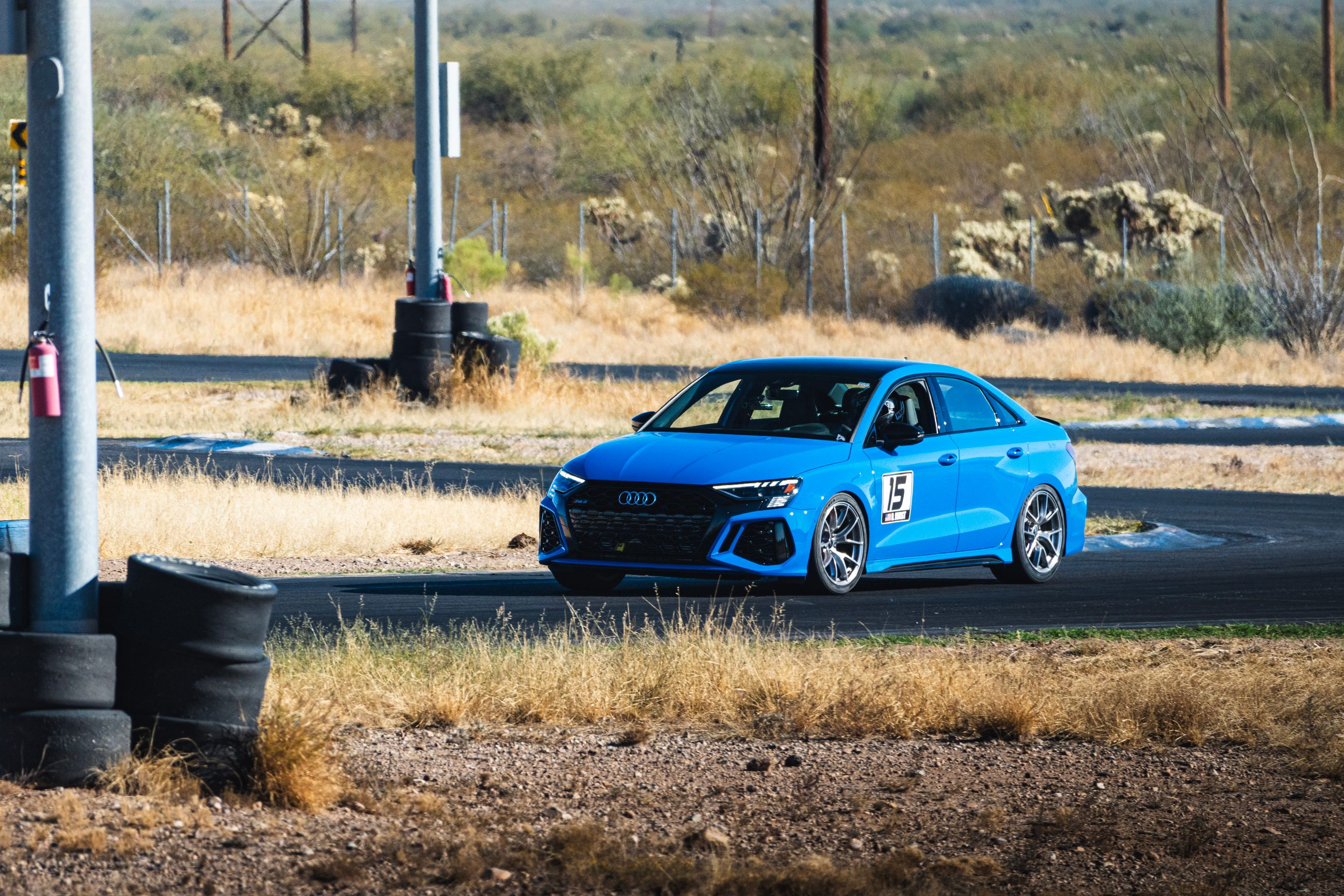 Blue Audi 8Y RS 3 with 18" VS-5RS Apex wheels in Brushed Clear