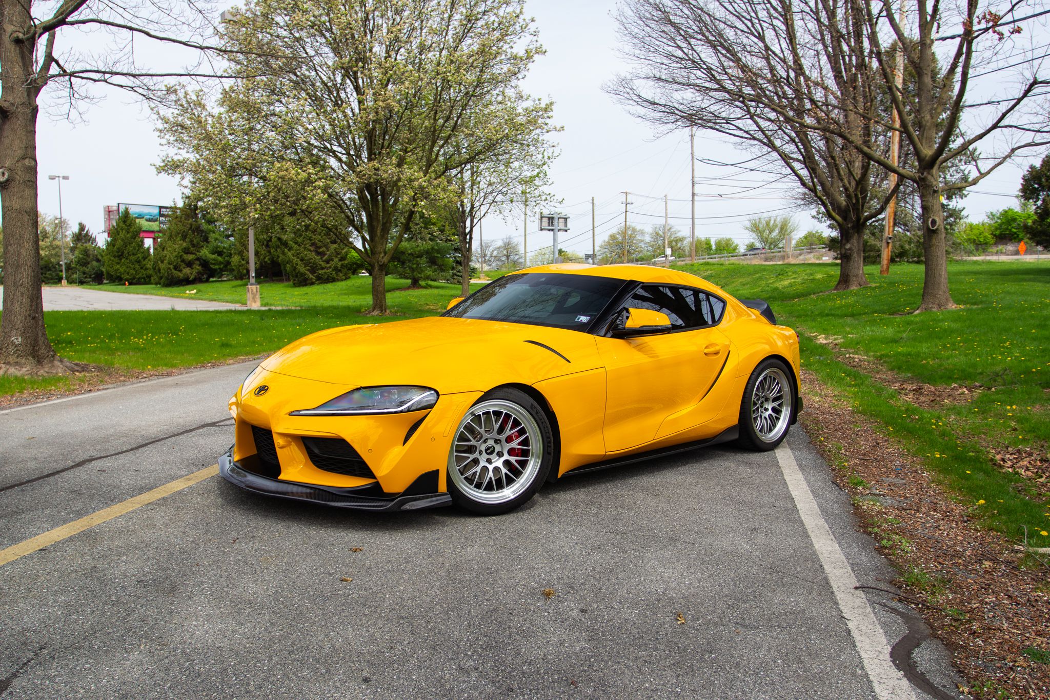 Yellow Toyota GR Supra with 19" ML-10RT Apex wheels in Machined Lip Race Silver