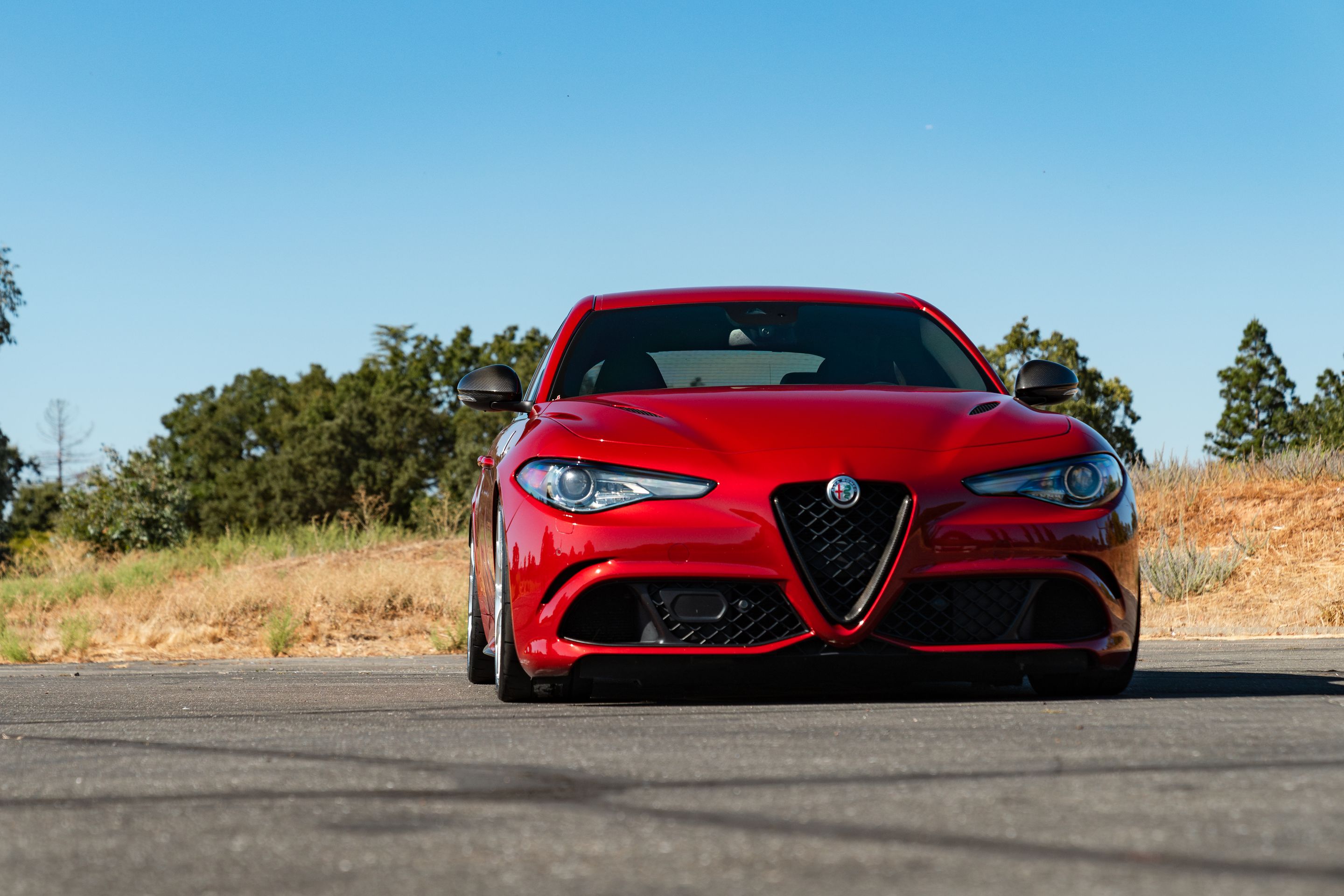 Red Alfa Romeo Giulia Quadrifoglio with 19" VS-5RS Apex wheels in Brushed Clear
