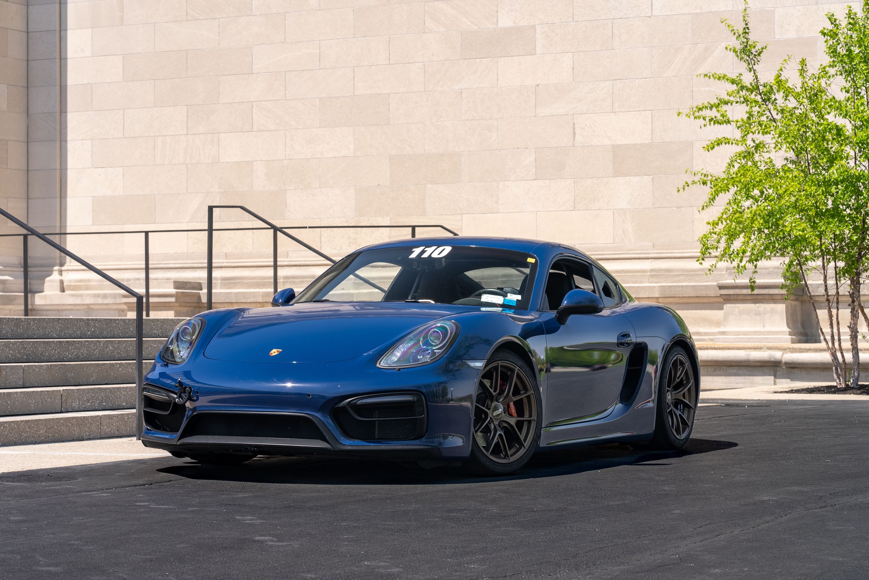 Blue Porsche 981 Cayman GTS with 18" VS-5RS Apex wheels in Satin Bronze