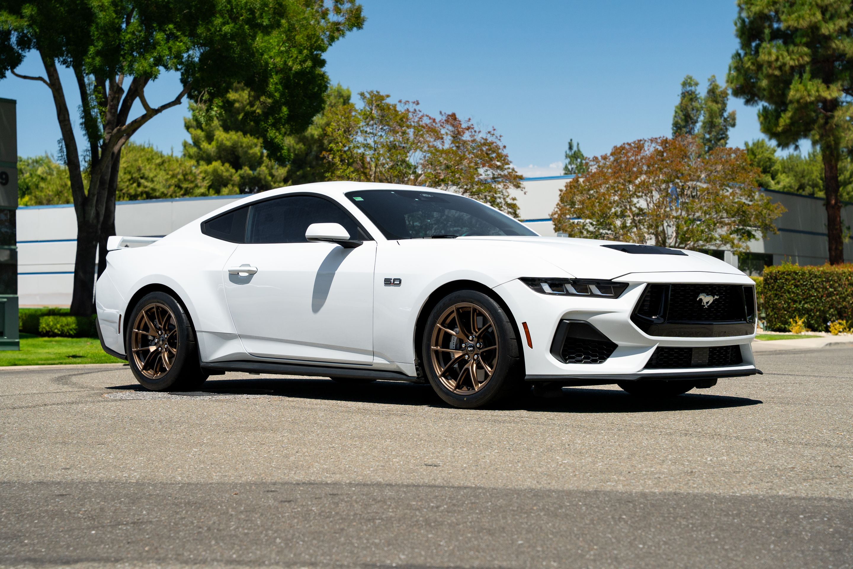 White Ford S650 Mustang GT with 18" VS-5RS Apex wheels in Satin Bronze