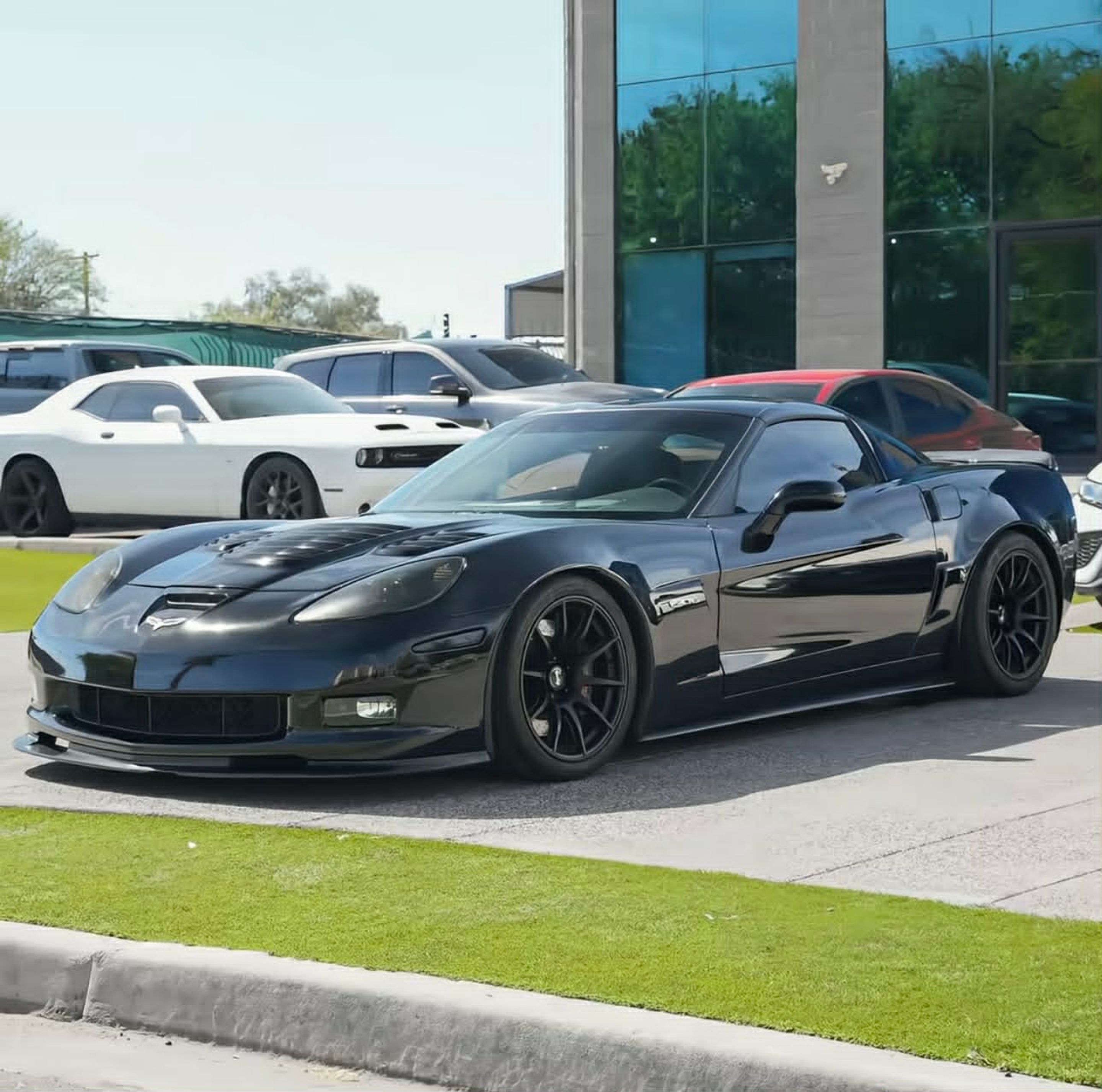 Black Chevrolet C6 Corvette Z06 with 18" SM-10 Apex wheels in Satin Black