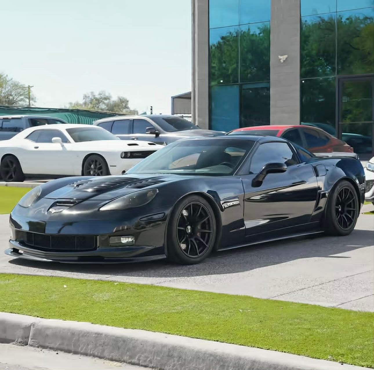 Black Chevrolet C6 Corvette Z06 with 18" SM-10 Apex wheels in Satin Black