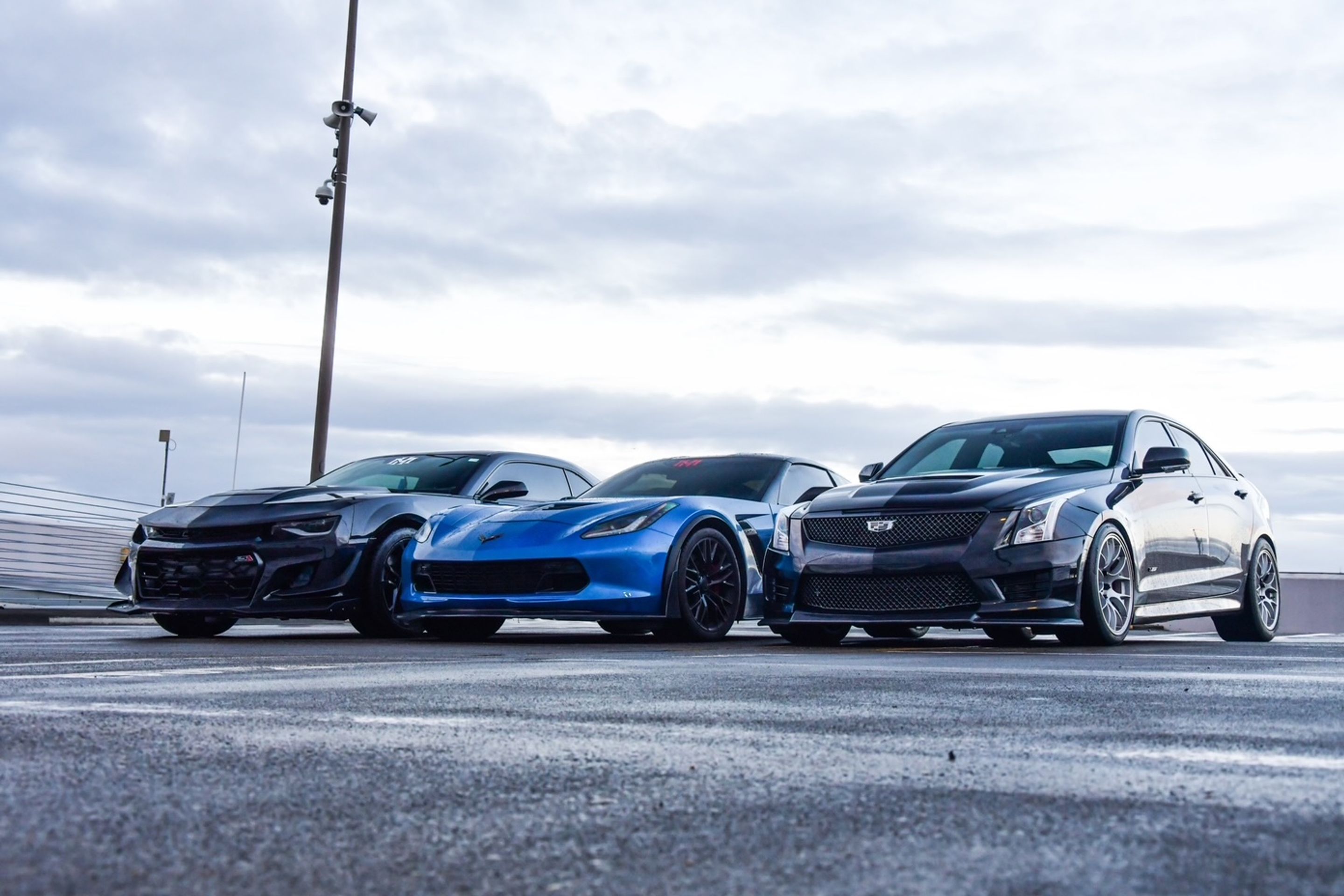 Black Cadillac ATS-V with 18" EC-7 Apex wheels in Race Silver