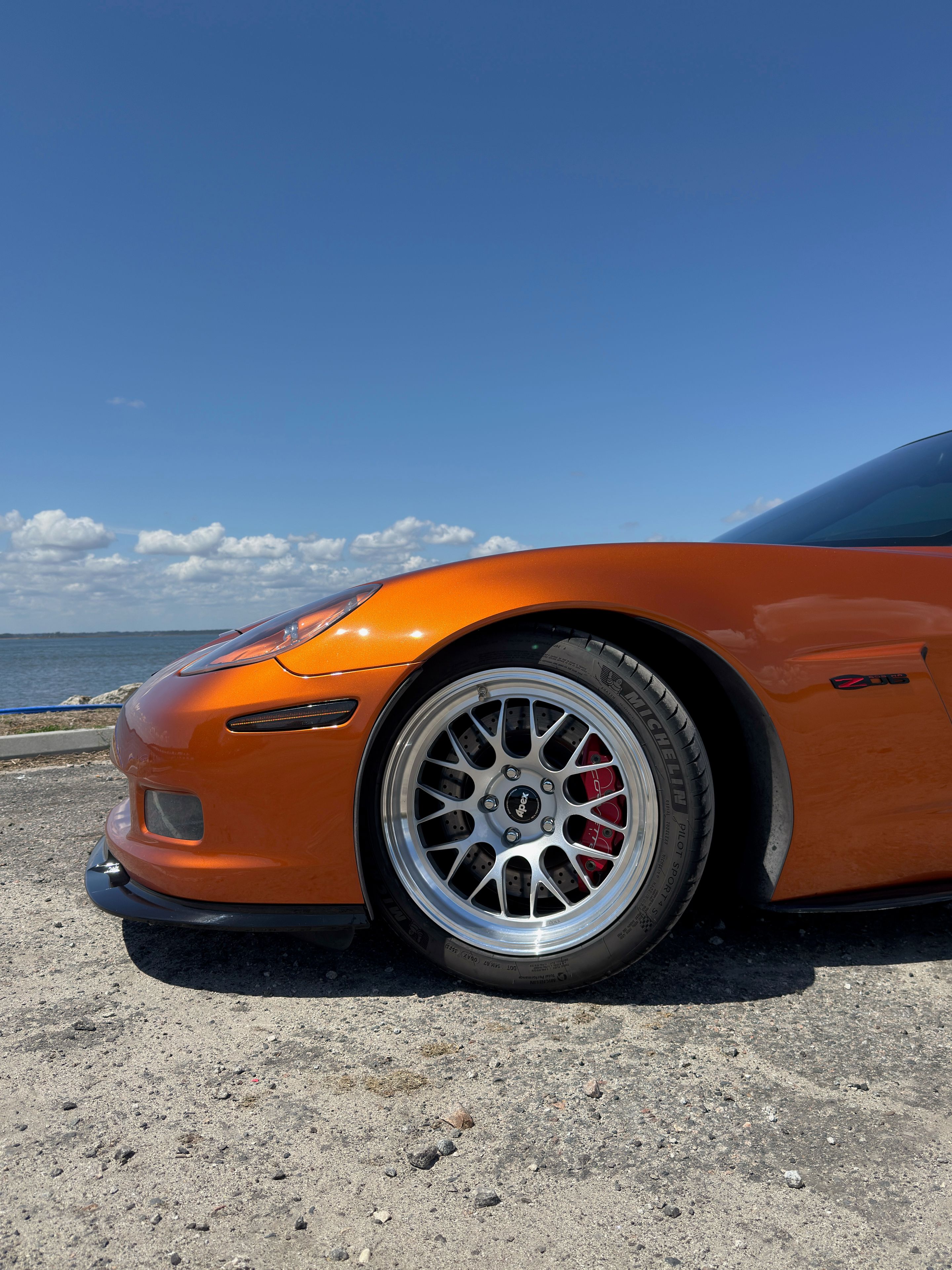 Orange Chevrolet C6 Corvette Z06 with 18"/19" ML-10RT Apex wheels in Machined Lip Race Silver