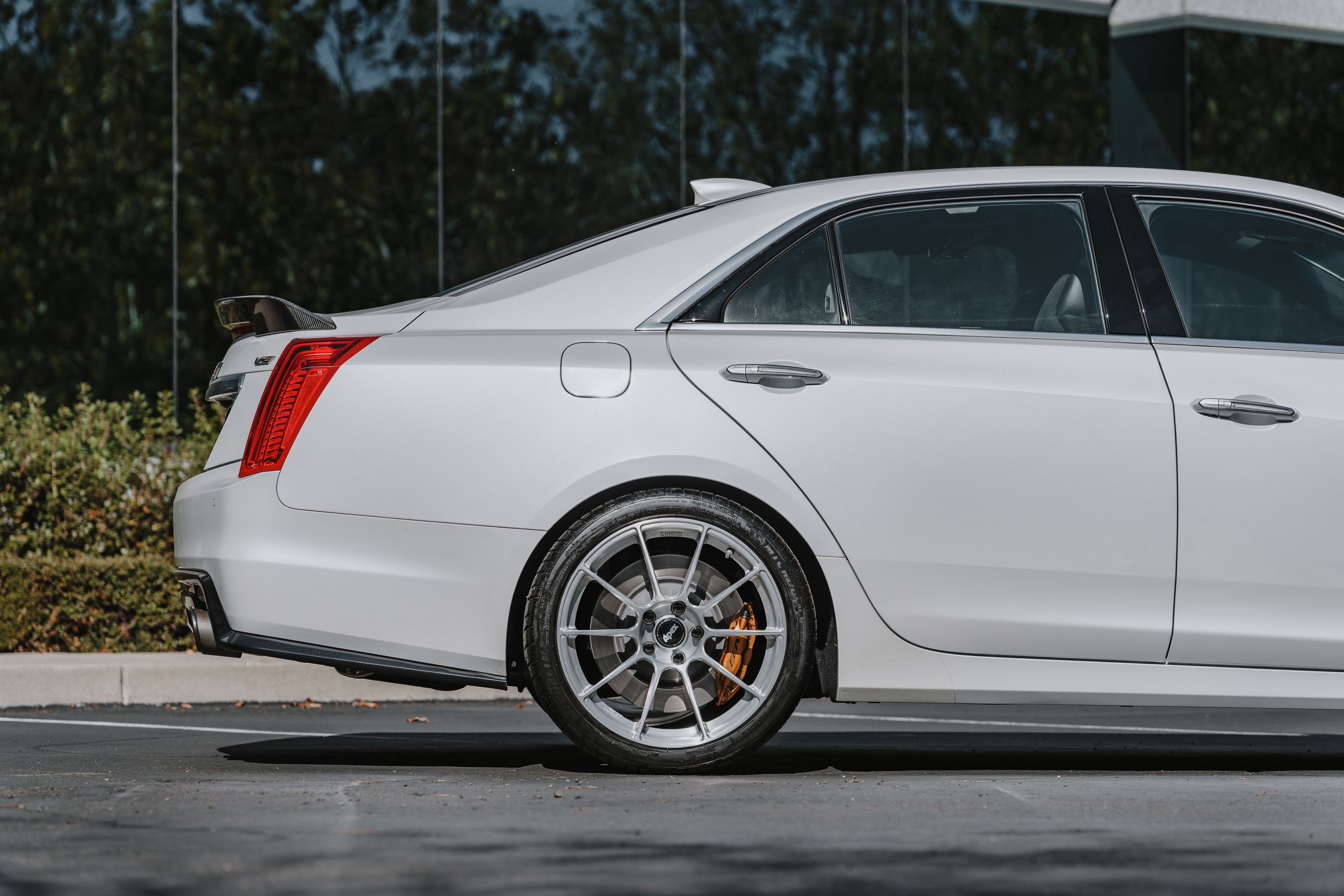 White Cadillac Gen 3 CTS-V with 19" SM-10RS Apex wheels in Brushed Clear