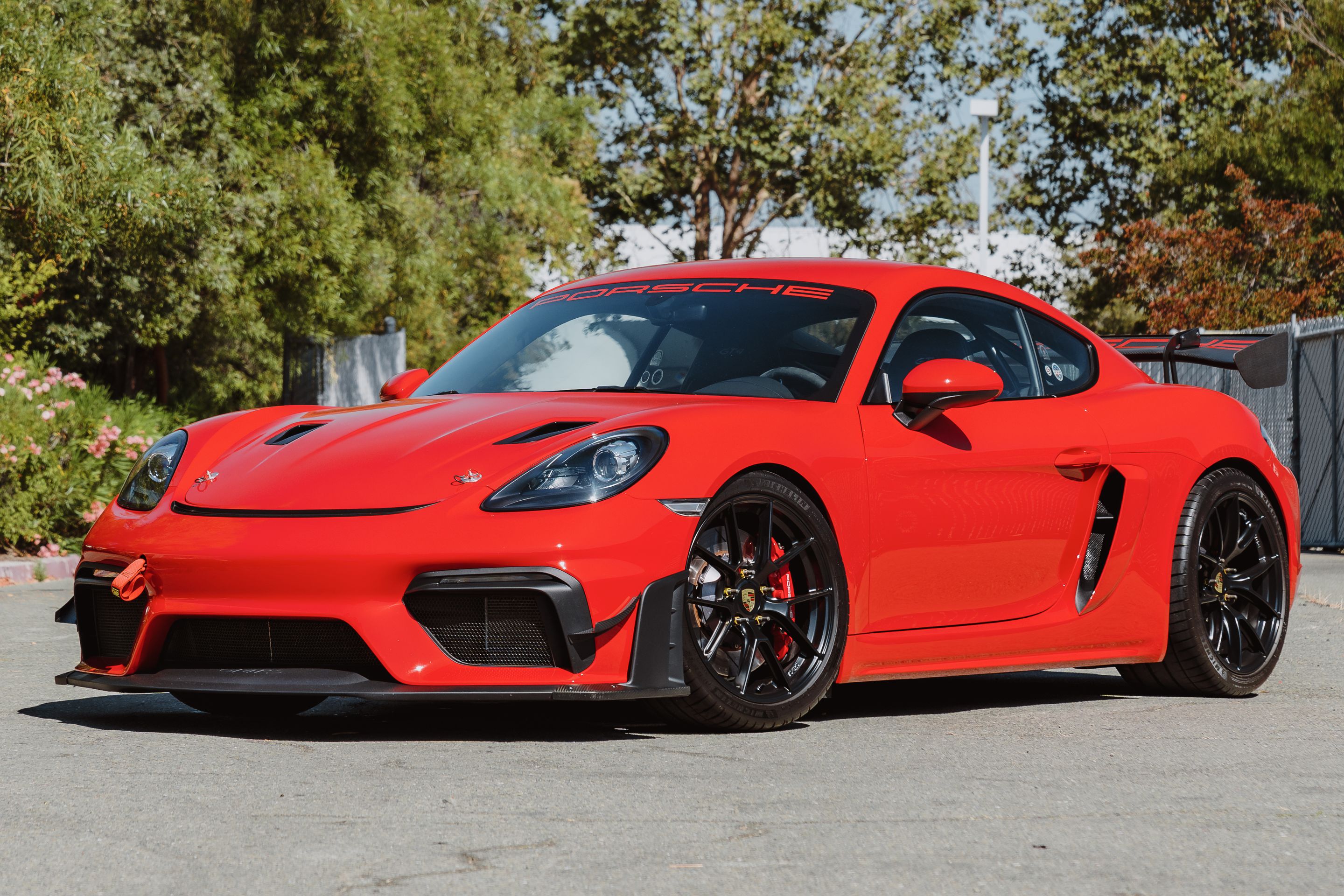 Red Porsche 718 Cayman GT4 with 19" VS-5RS Apex wheels in Satin Black