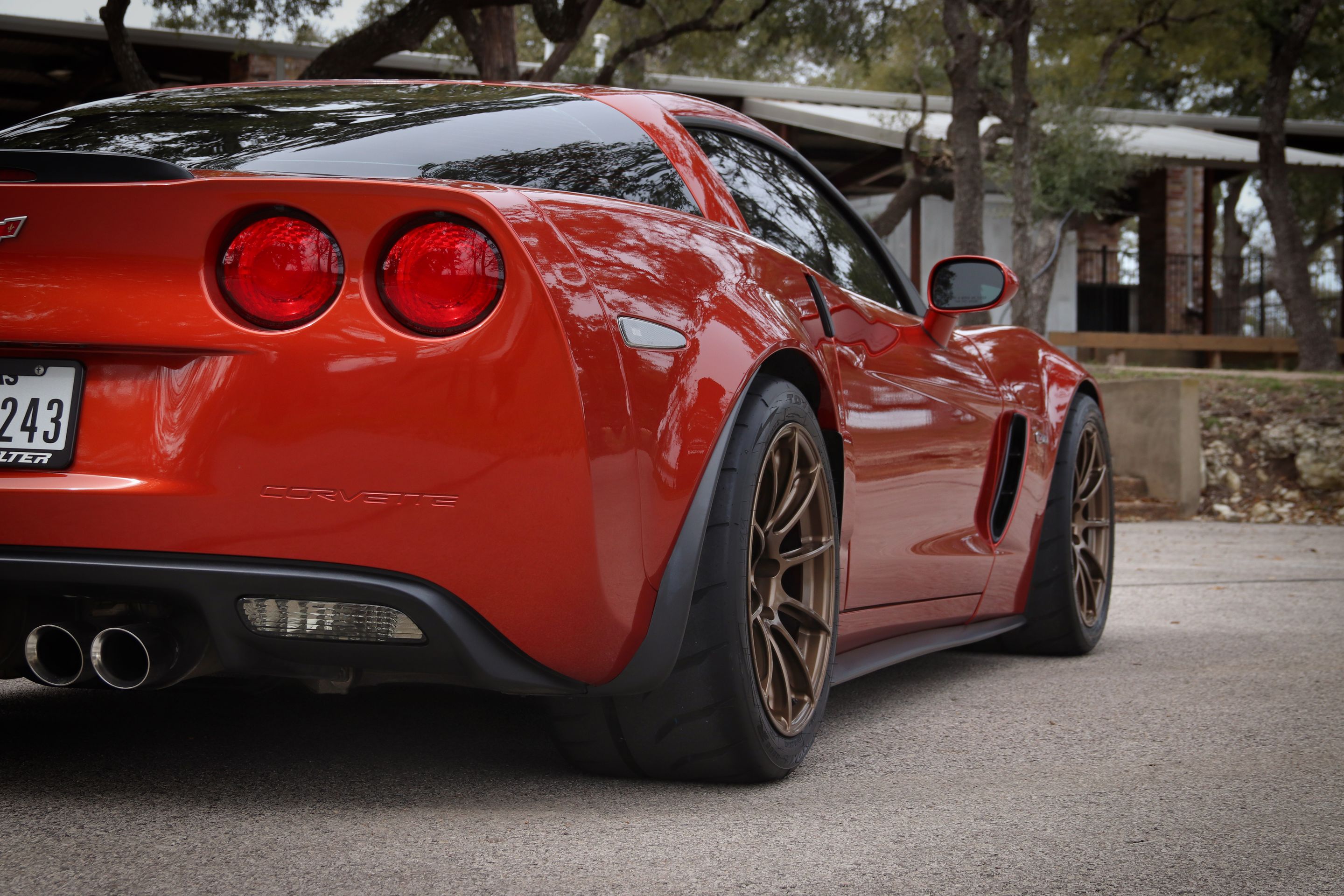 Red Chevrolet C6 Corvette Z06 with 18" SM-10RS Apex wheels in Satin Bronze