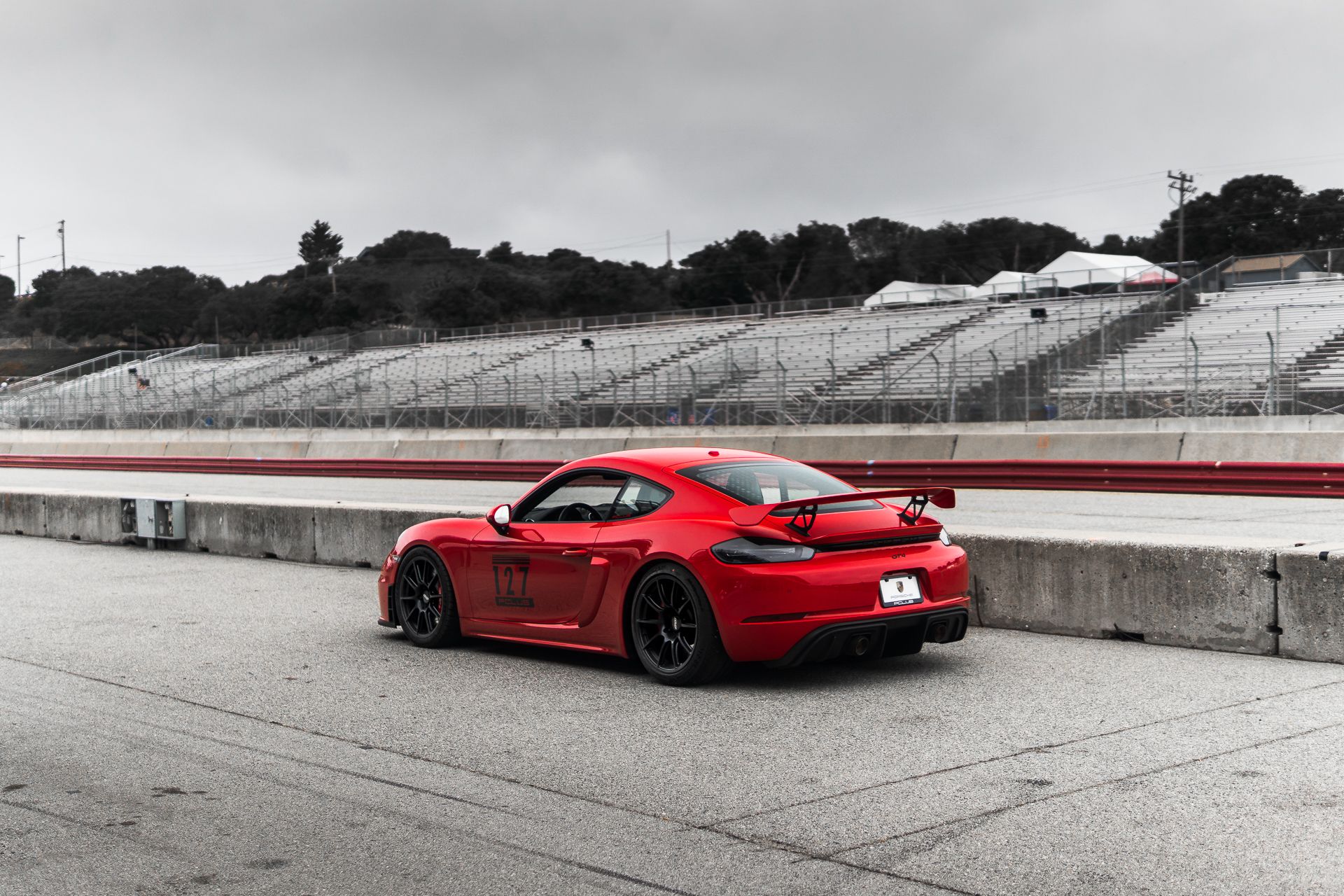 Red Porsche 718 Cayman GT4 with 19" SM-10 Apex wheels in Satin Black