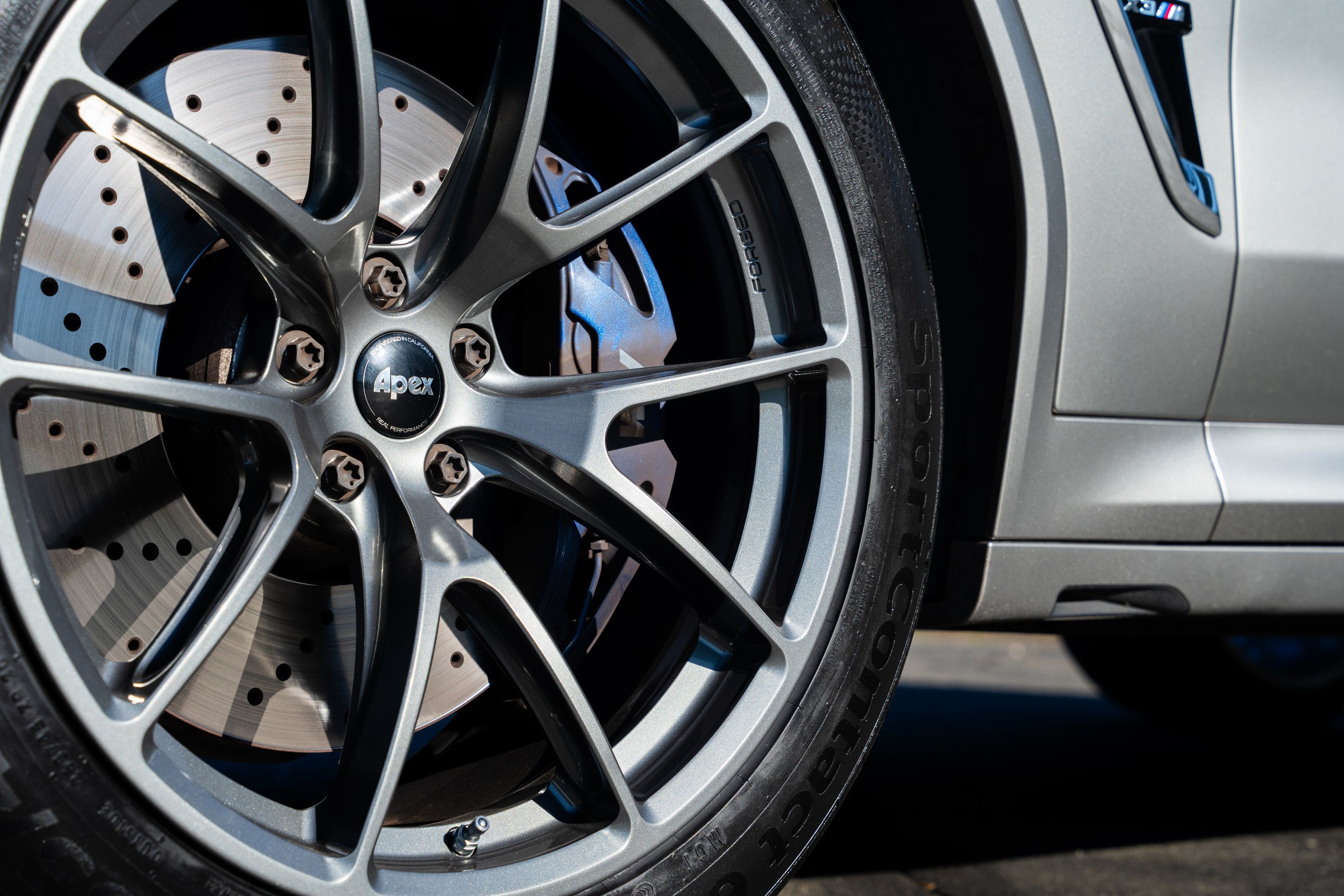 Silver BMW F97 X3M with 20" VS-5RX Apex wheels in Anthracite