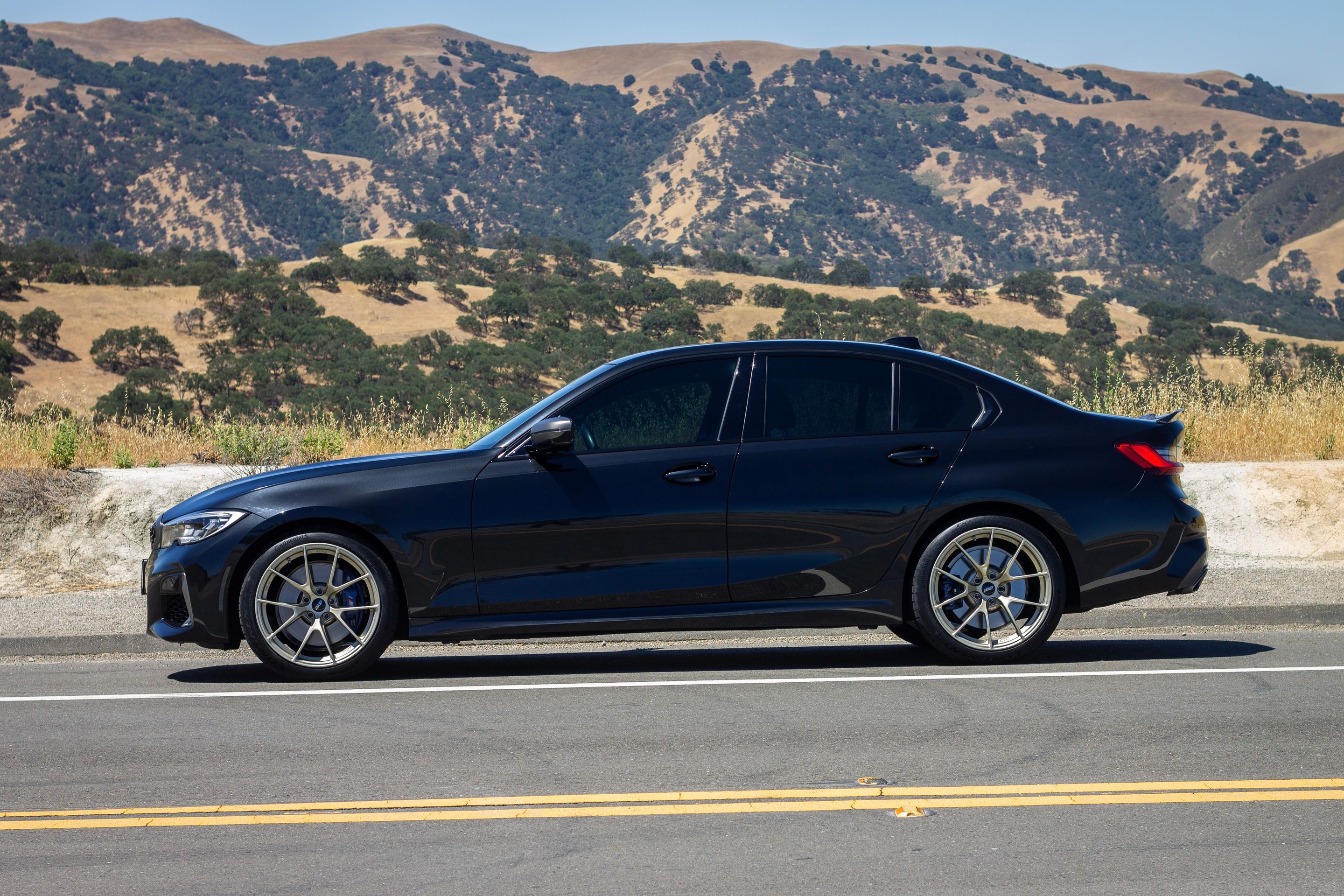 Black BMW G20 Sedan 3 Series with 19" VS-5RS Apex wheels in Motorsport Gold