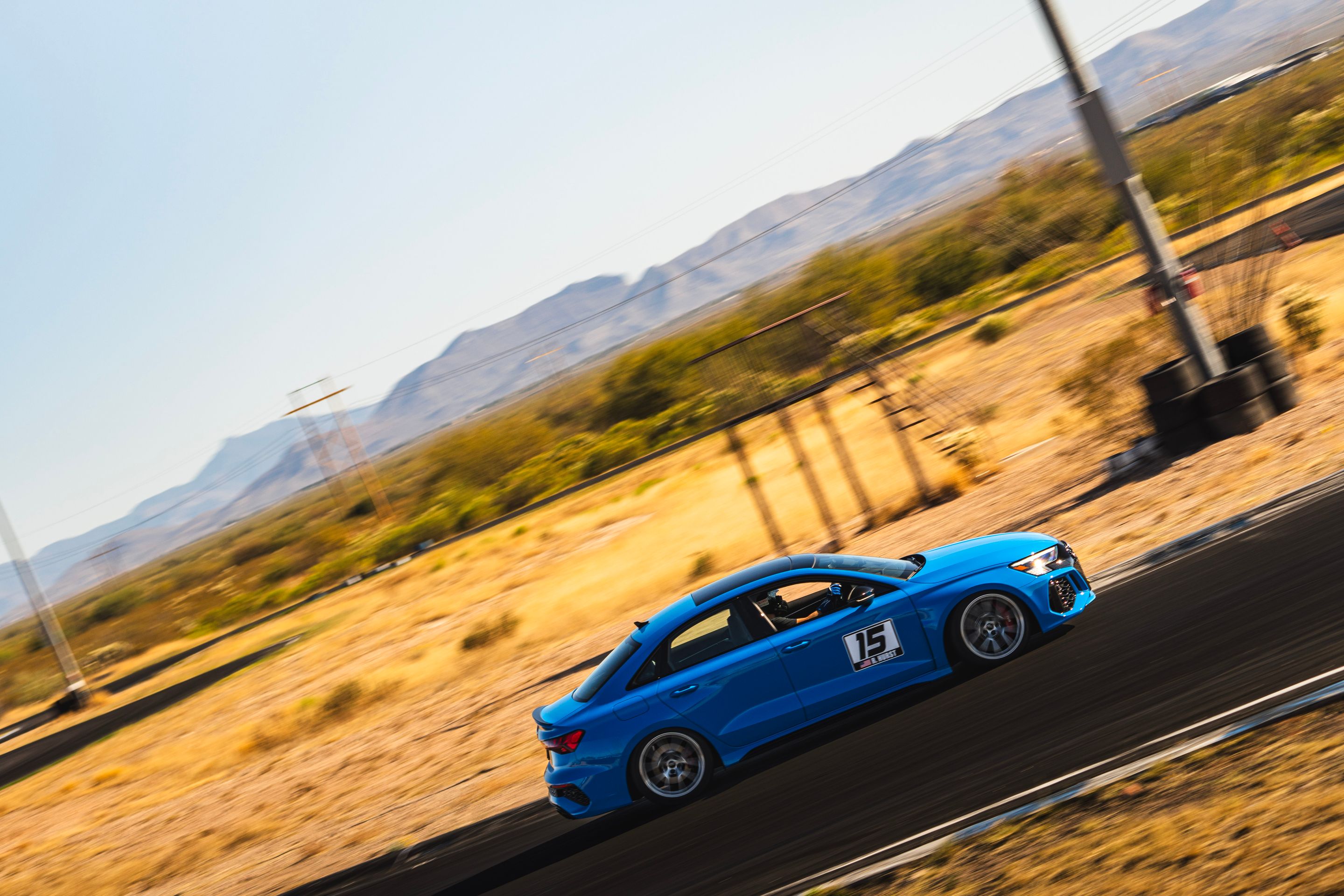 Blue Audi 8Y RS 3 with 18" VS-5RS Apex wheels in Brushed Clear