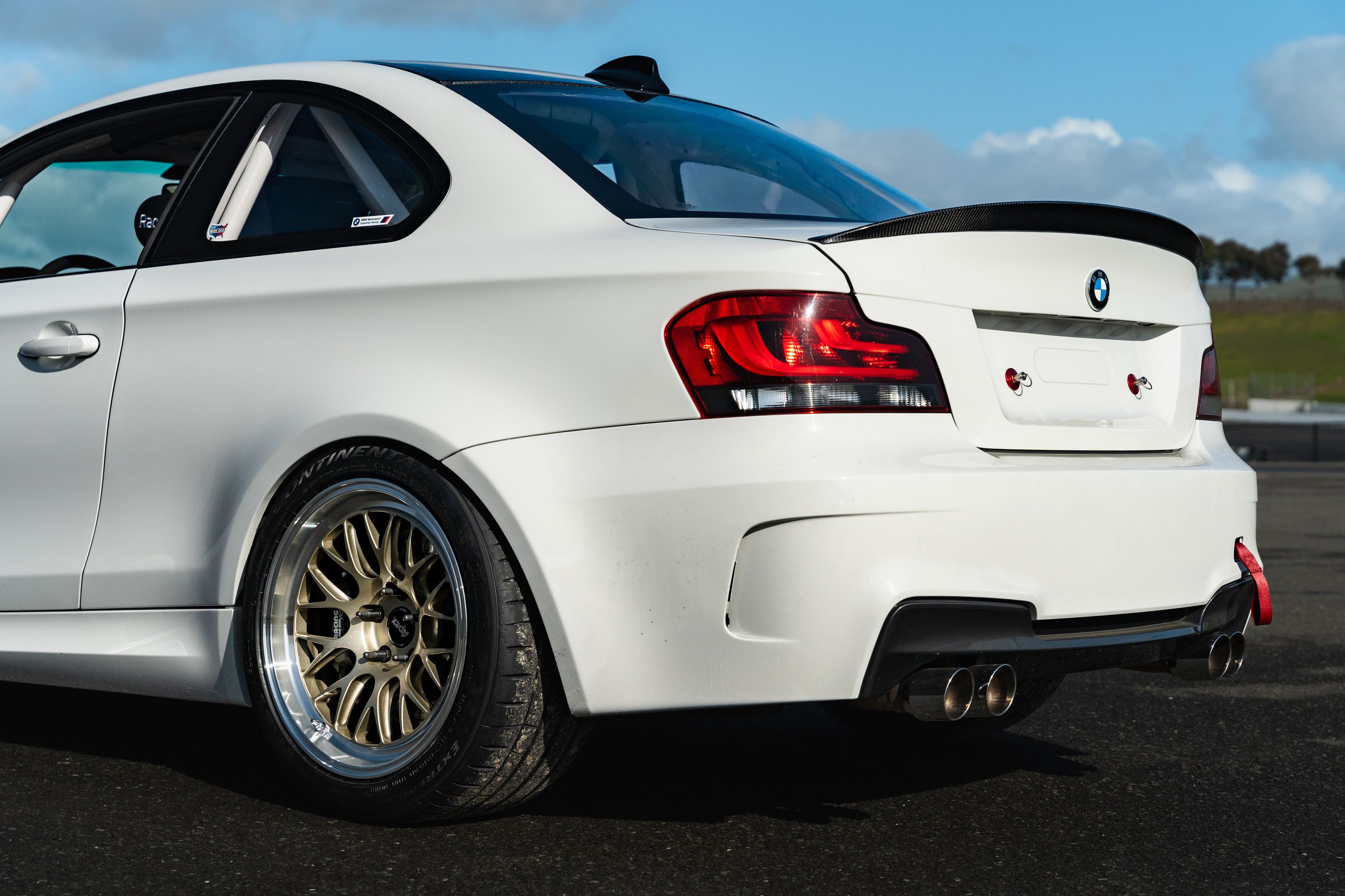 White BMW E82 1M with 18" ML-10RT Apex wheels in Machined Lip Gloss Motorsport Gold