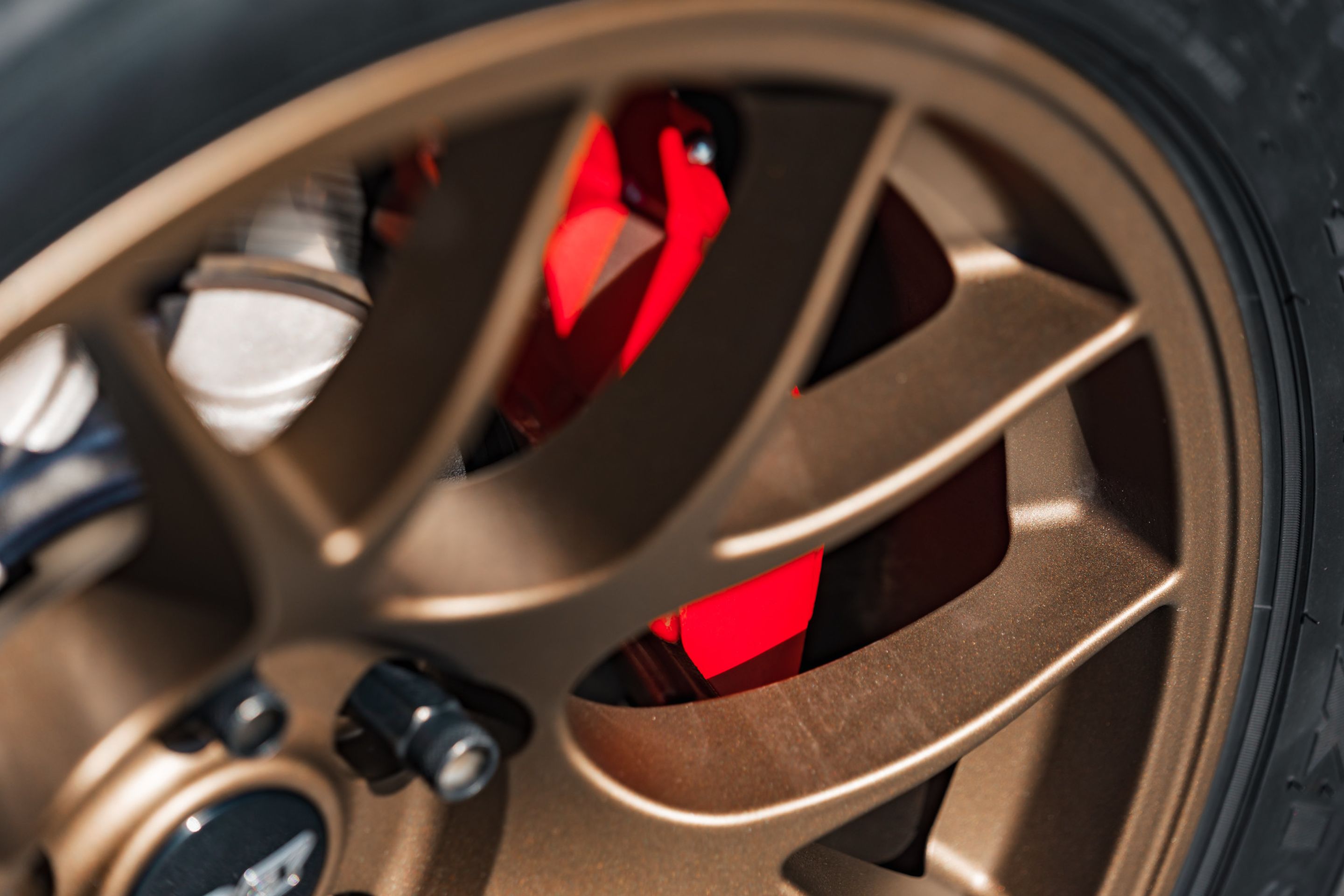 Red Toyota GR Corolla with 18" EC-7 Apex wheels in Satin Bronze