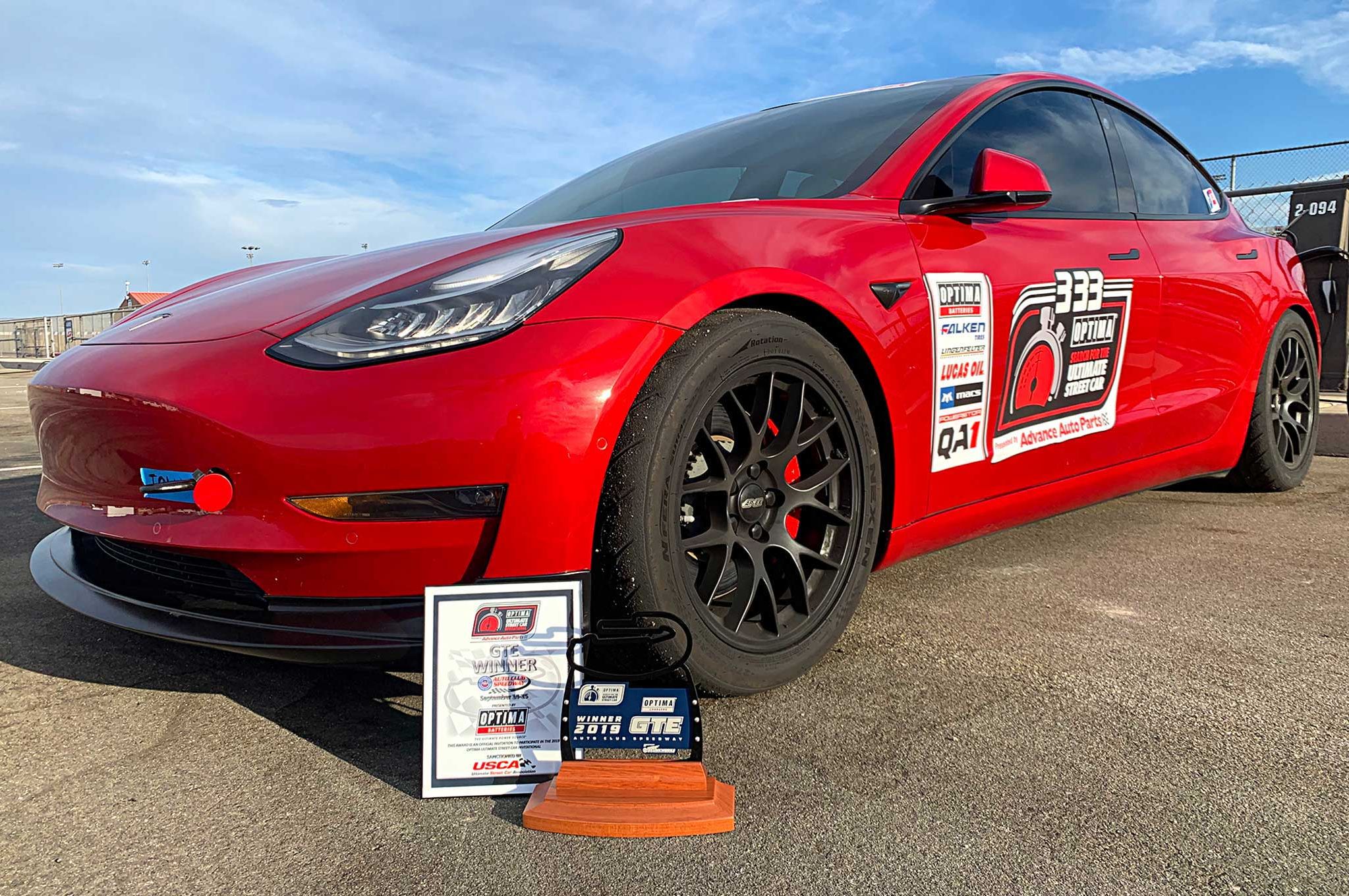 Red Tesla Model 3 with 18" EC-7 Apex wheels in Satin Black