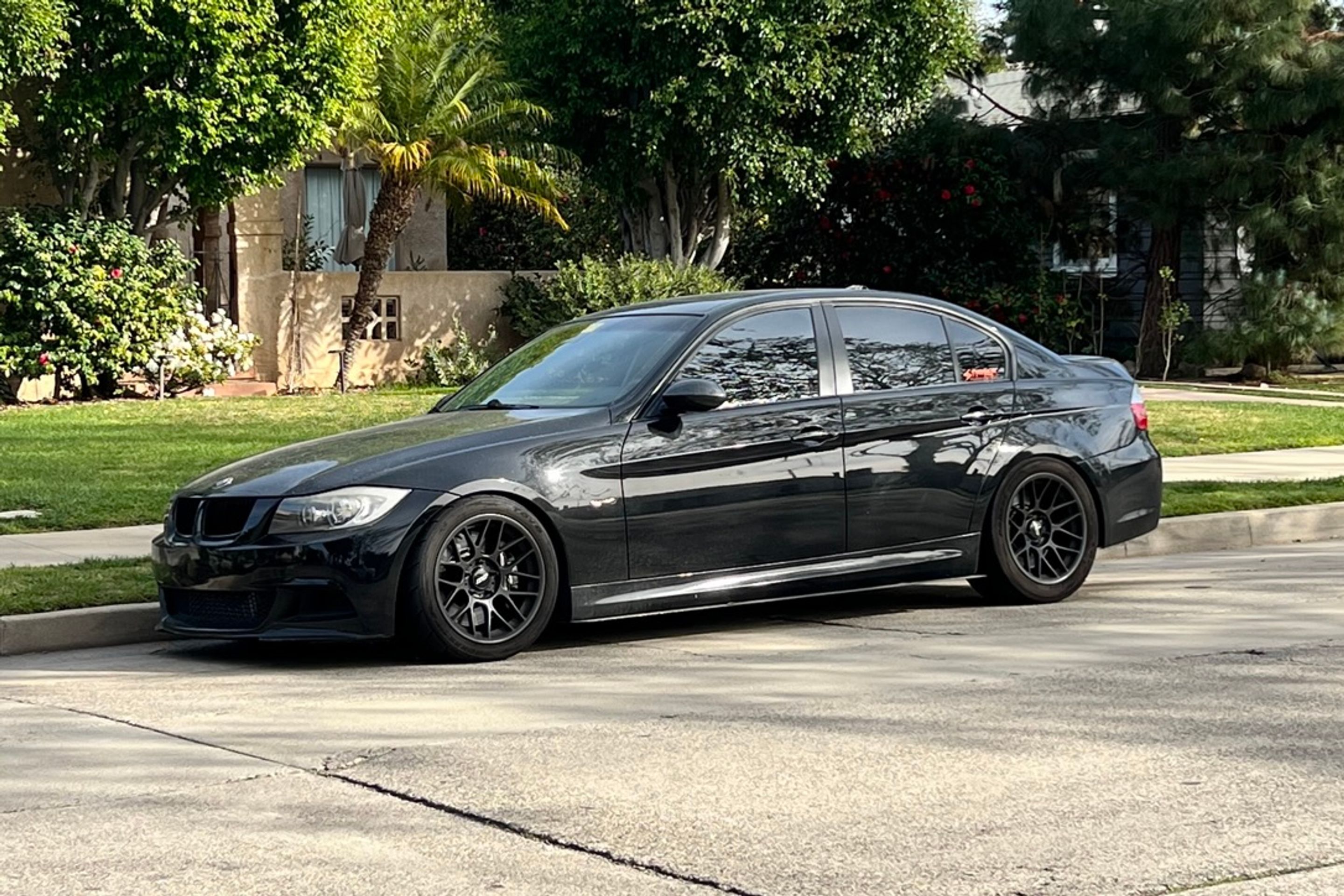 Black BMW E90 Sedan 3 Series with 17" ARC-8 Apex wheels in Satin Black