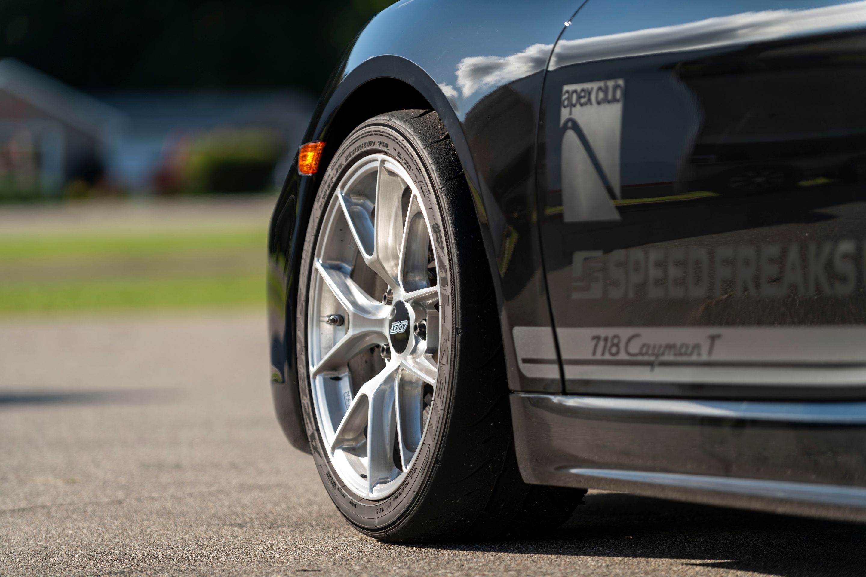 Black Porsche 718 Cayman T with 18" VS-5RS Apex wheels in Brushed Clear