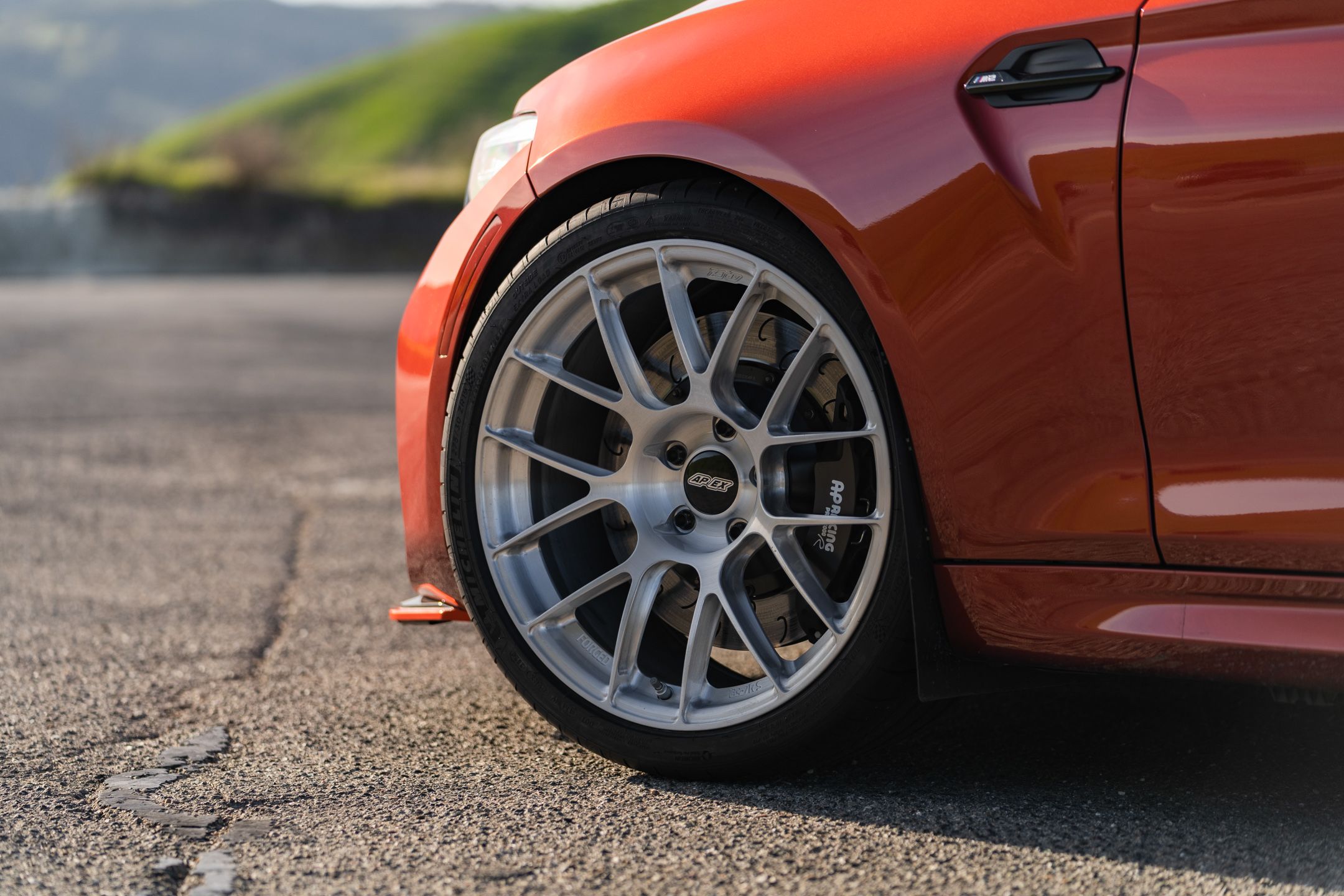 Orange BMW F87 M2 with 19" EC-7RS Apex wheels in Brushed Clear