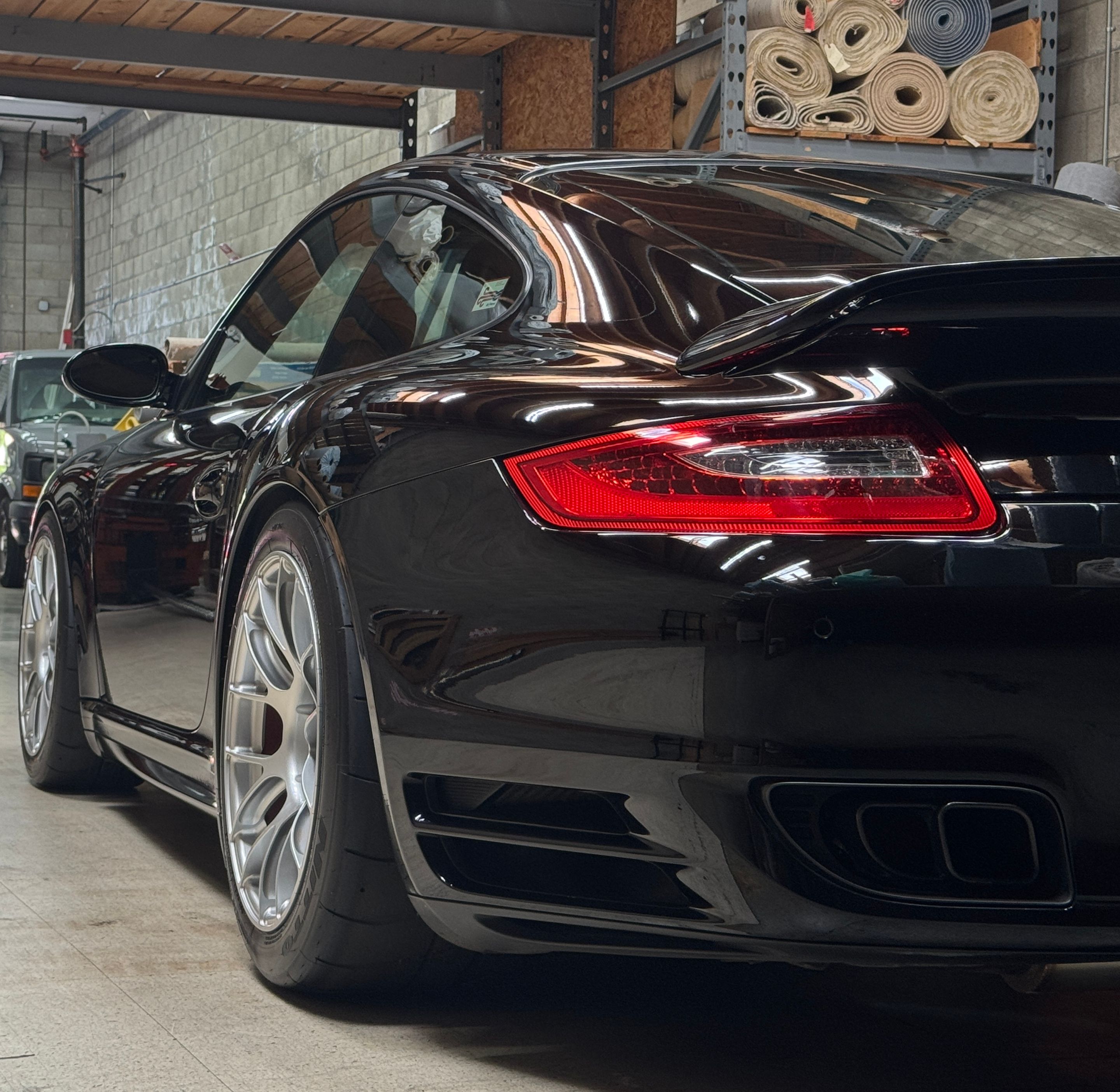 Black Porsche 911 997 Turbo with 18" EC-7RS Apex wheels in Race Silver