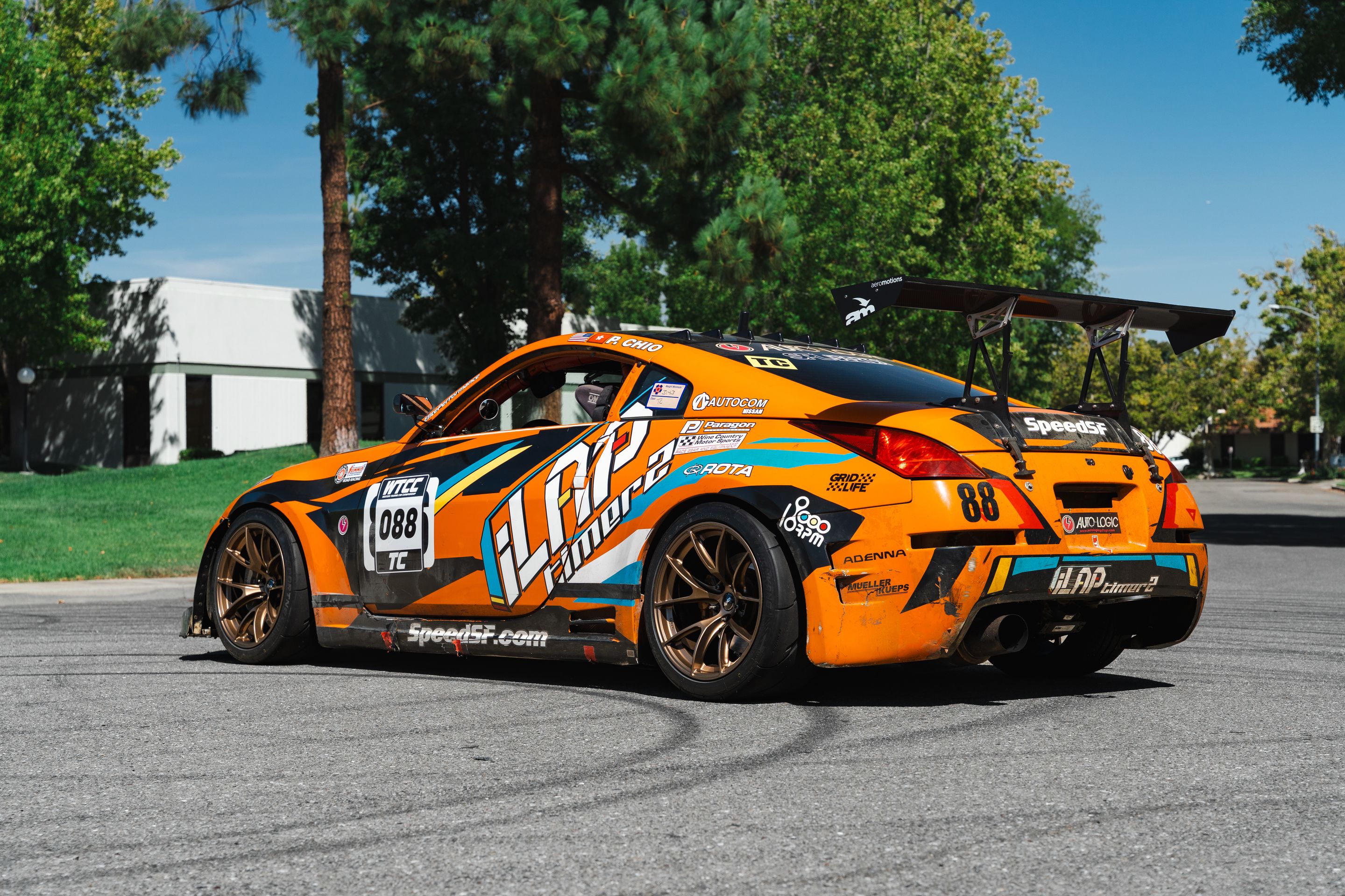 Orange Nissan 350Z with 18" VS-5RS Apex wheels in Satin Bronze