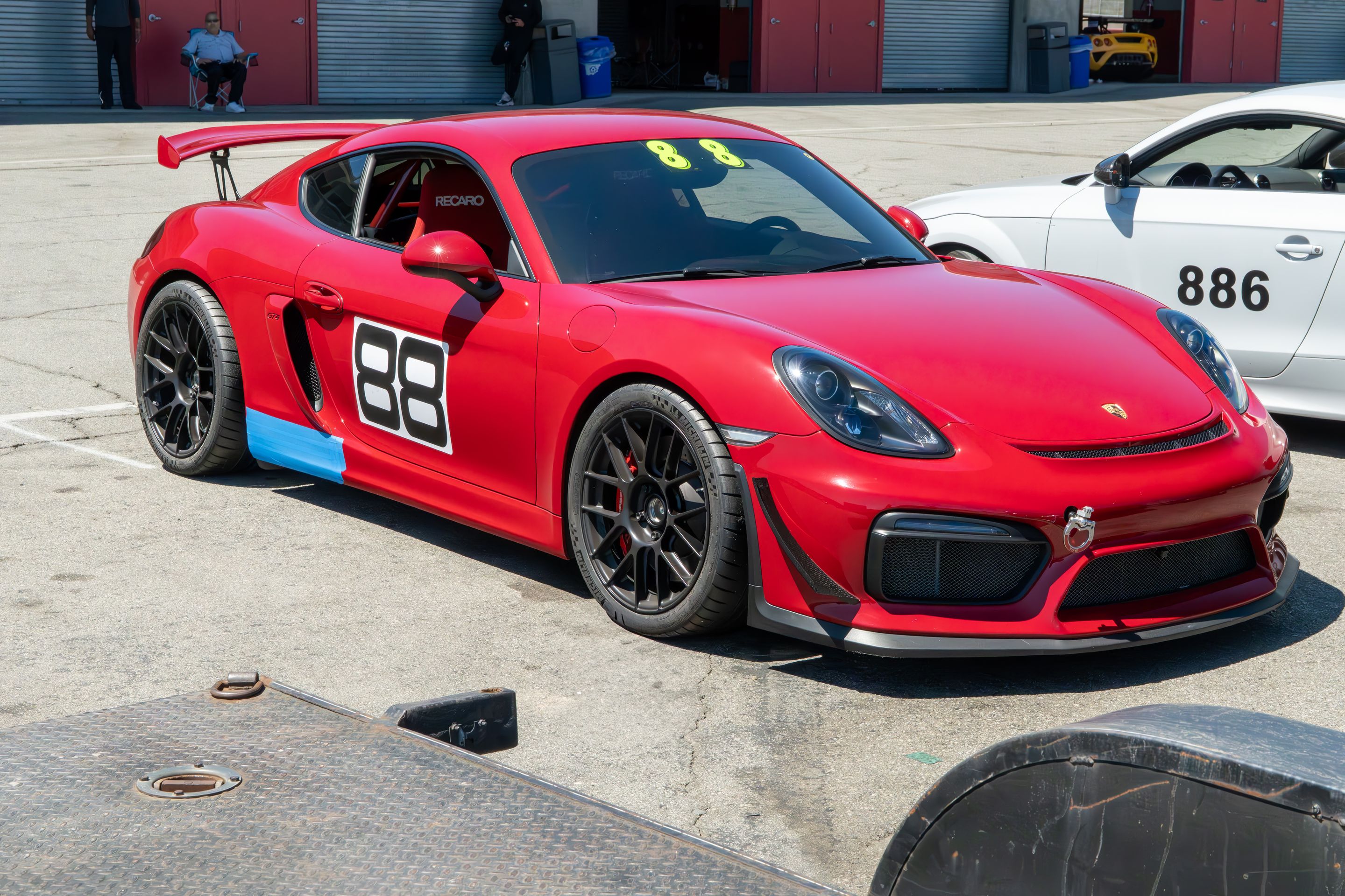 Red Porsche 981 Cayman GT4 with 19" EC-7RS Apex wheels in Satin Black