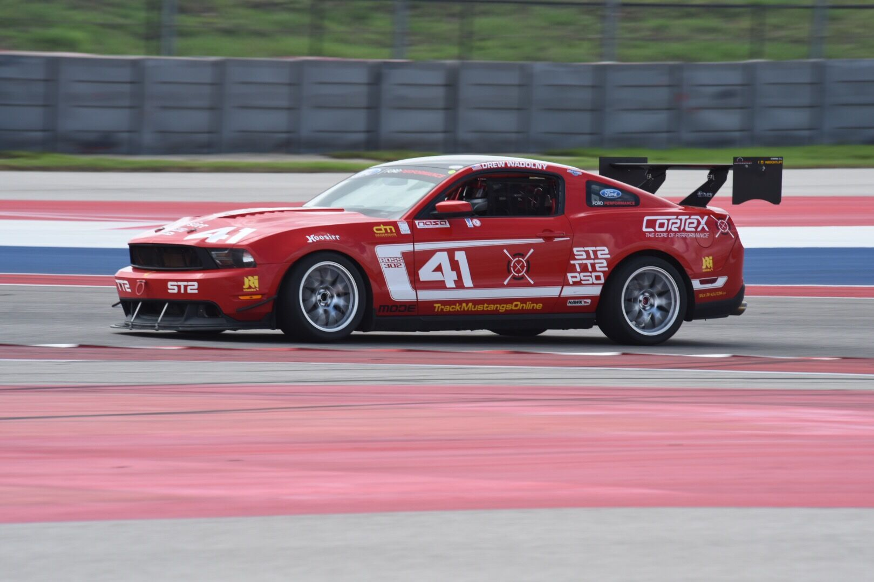 Red Ford S197 Mustang Boss 302 with 18" EC-7 Apex wheels in Race Silver