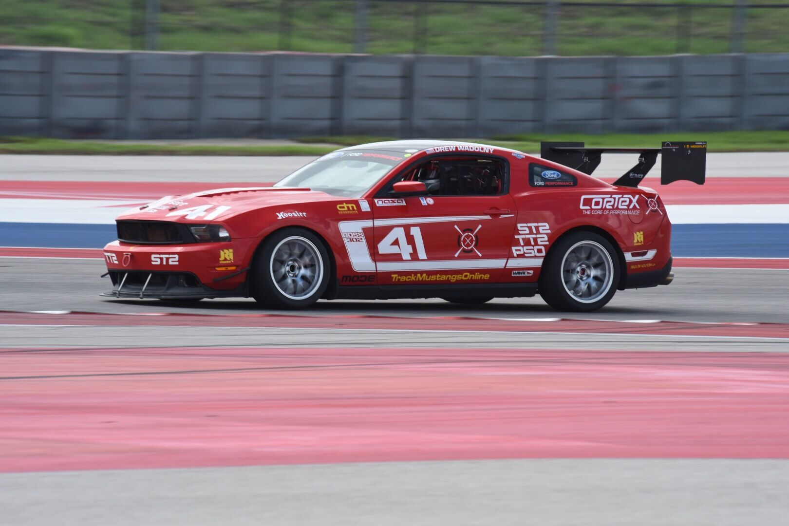 Red Ford S197 Mustang Boss 302 with 18" EC-7 Apex wheels in Race Silver