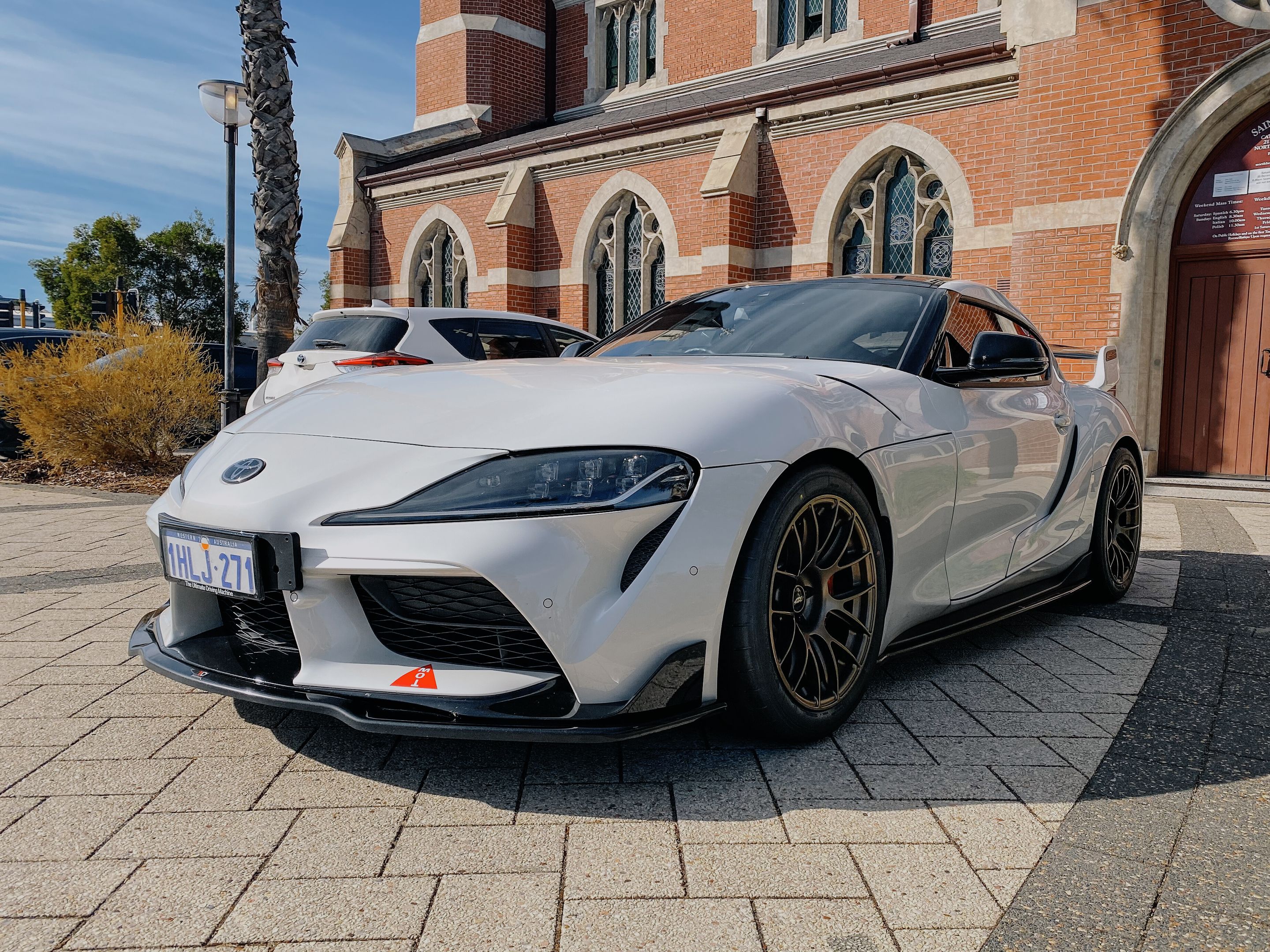 White Toyota GR Supra with 18" EC-7RS Apex wheels in Satin Bronze