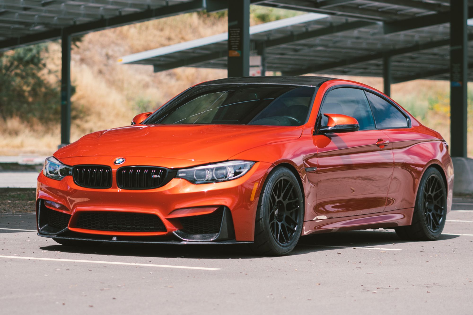 Red BMW F82 Coupe M4 with 18" ARC-8R Apex wheels in Satin Black