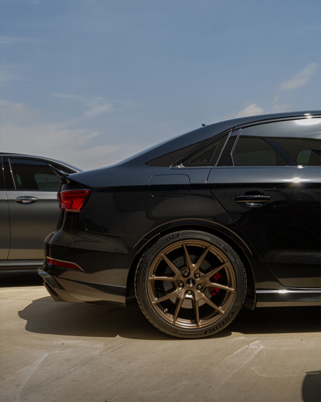 Black Audi 8V RS 3 with 18" VS-5 Apex wheels in Satin Bronze