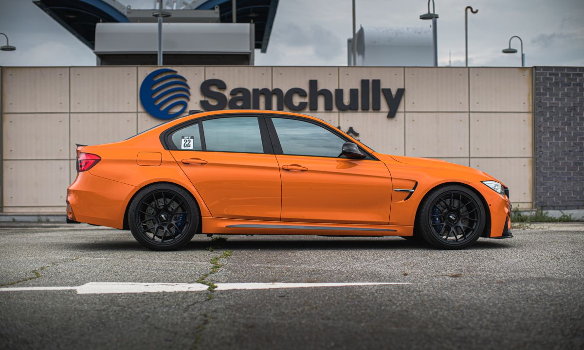 Orange BMW F80 M3 with 19" EC-7 Apex wheels in Satin Black