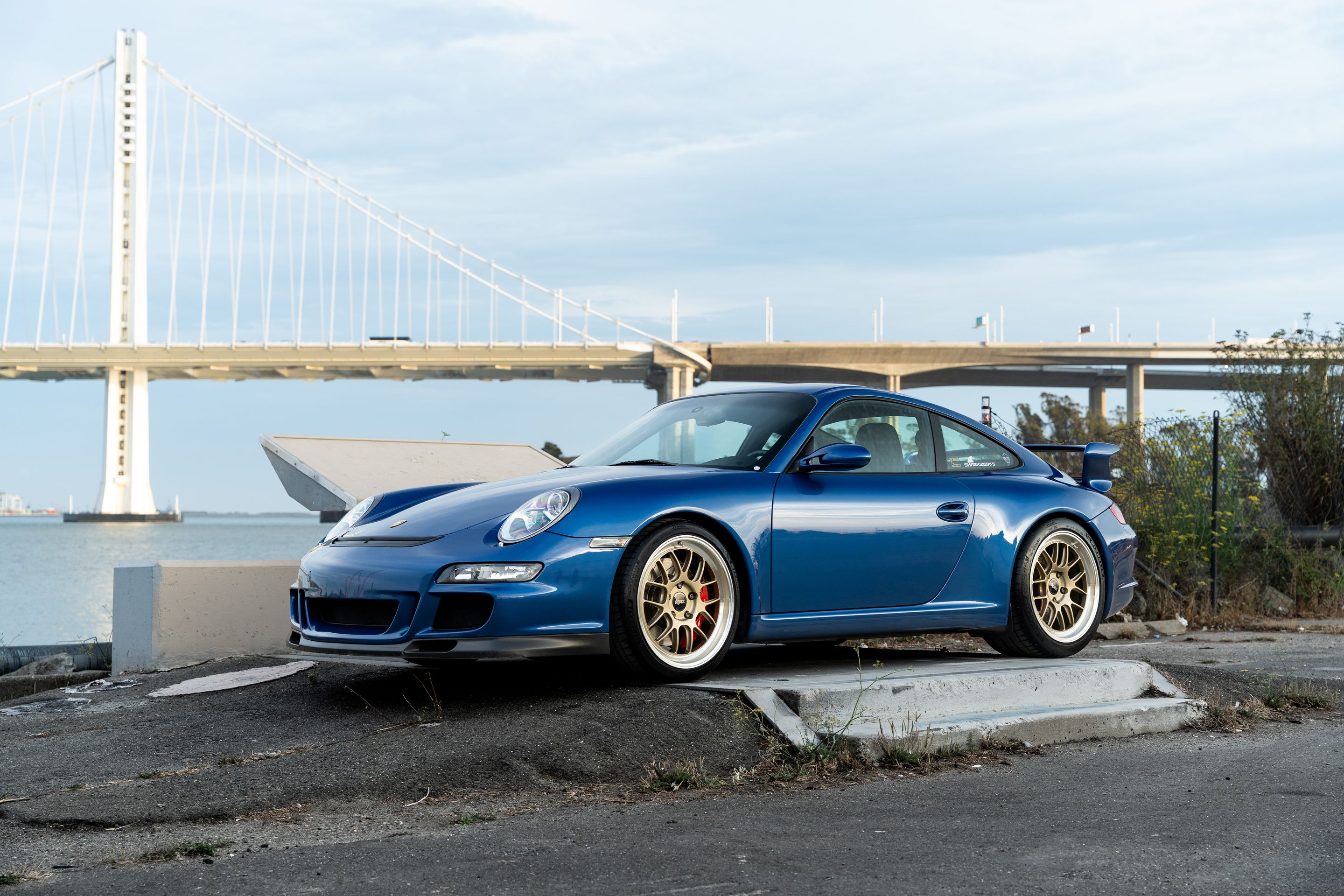 Blue Porsche 911 997 GT3 with 19" TEST-M Apex wheels in Machined Lip Gloss Motorsport Gold