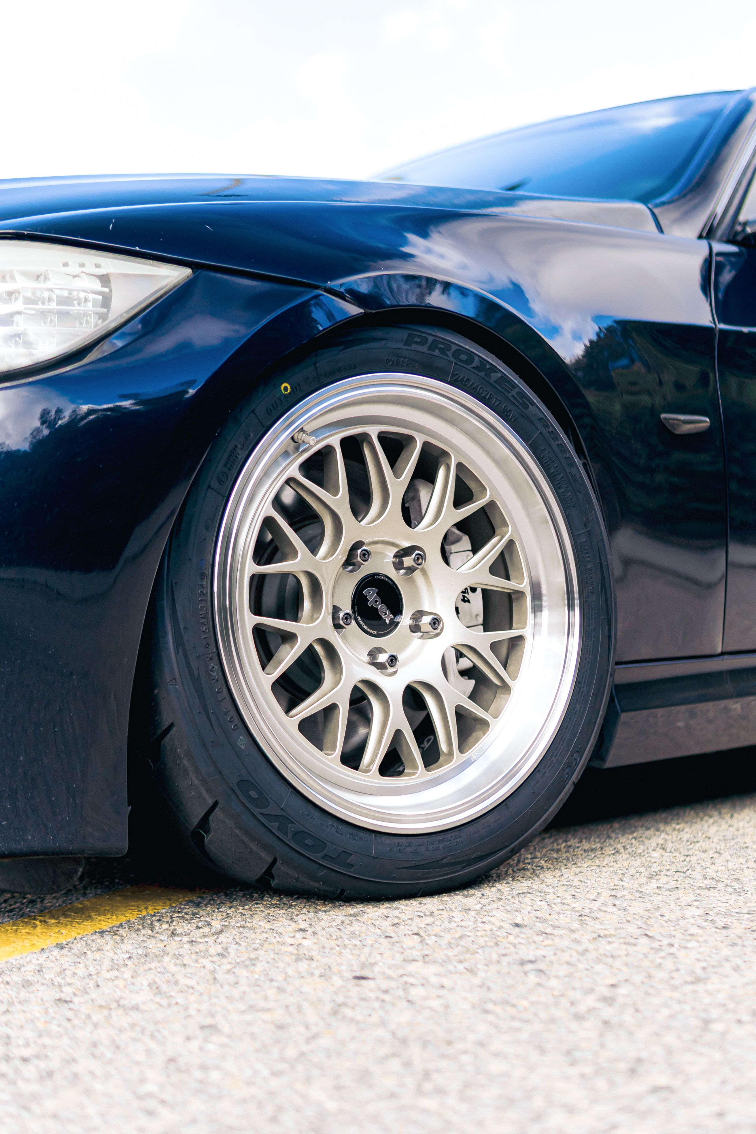 Black BMW E90 Sedan 3 Series with 17" ML-10RT Apex wheels in Machined Lip Gloss Motorsport Gold