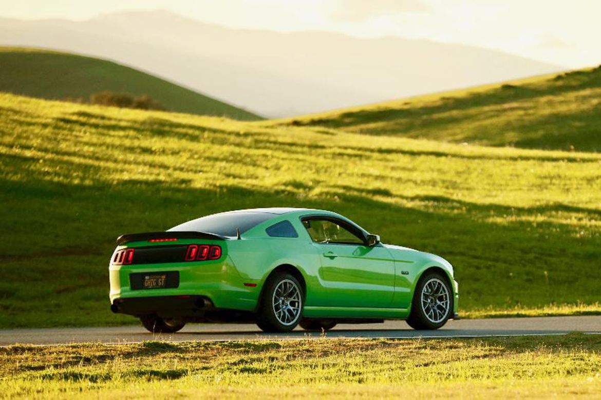 Green Ford S197 Mustang GT with 18" EC-7 Apex wheels in Race Silver