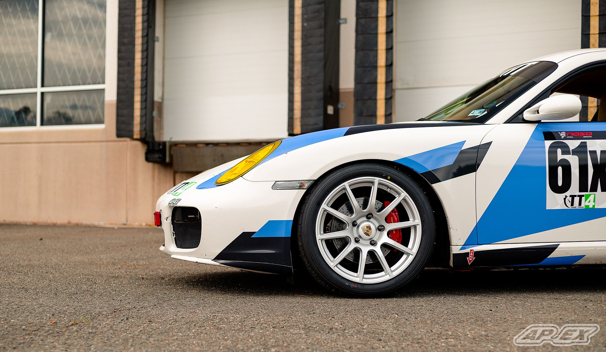 White Porsche 987 Cayman S with 18" SM-10 Apex wheels in Race Silver
