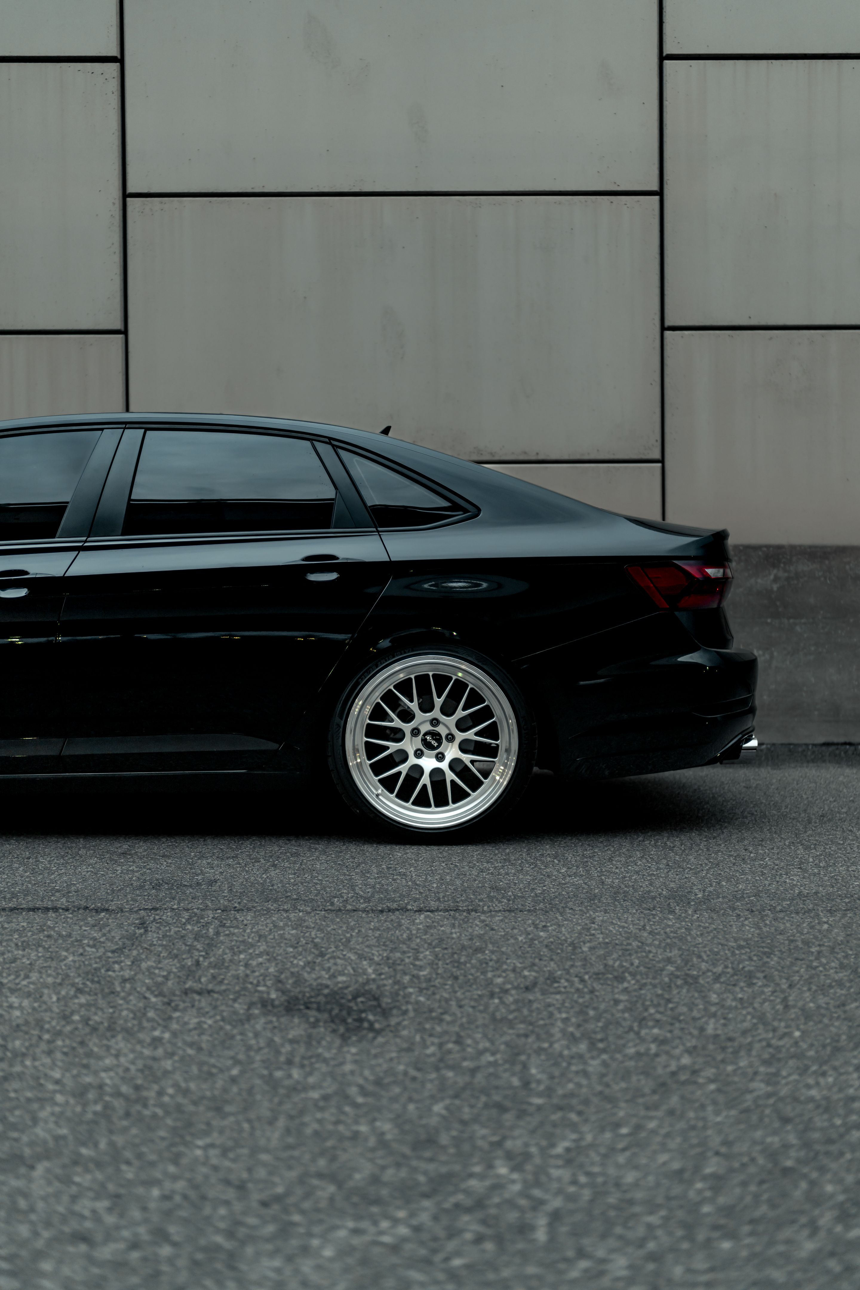 Black VW MK7 Jetta with 19" ML-10RT Apex wheels in Machined Lip Race Silver