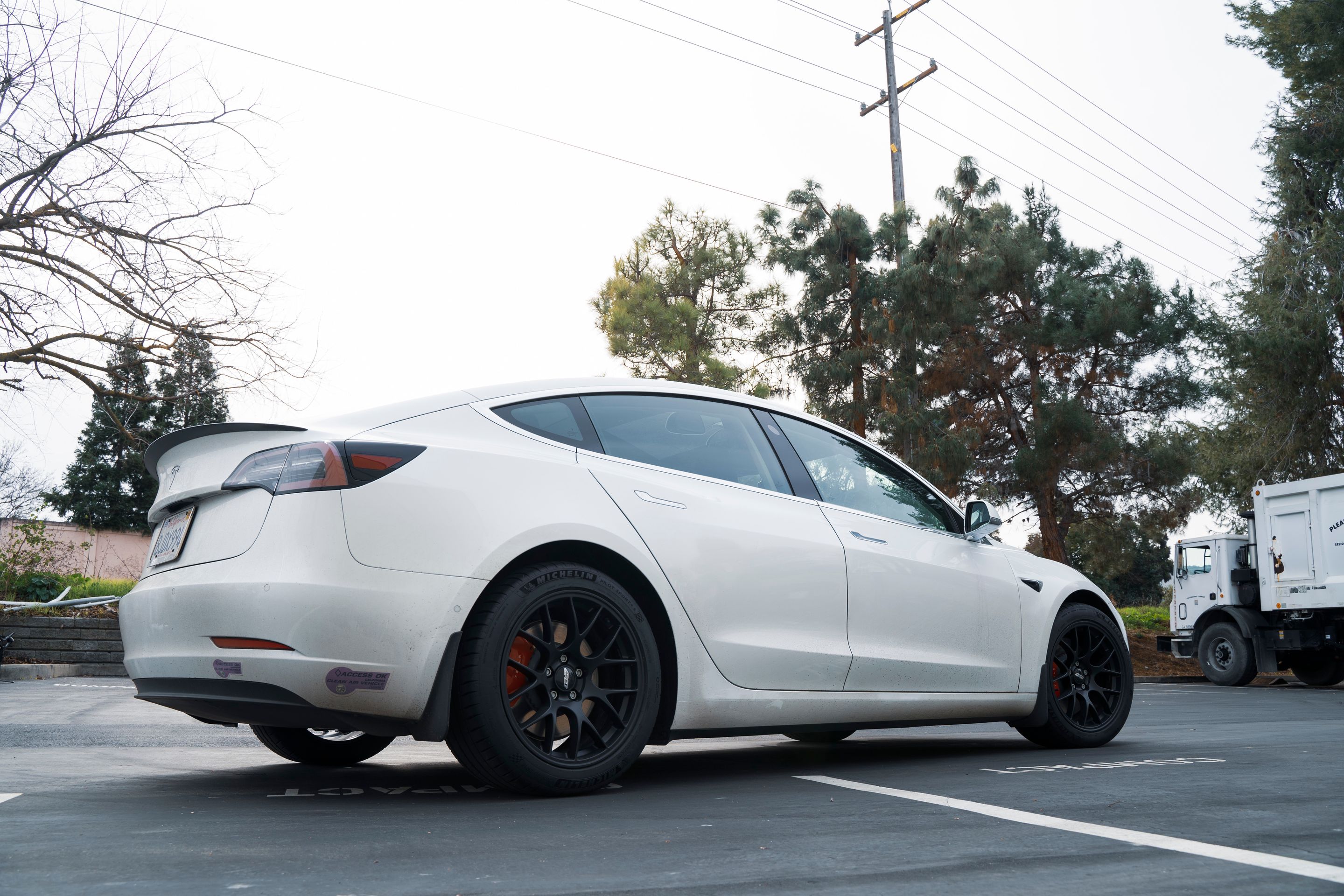 White Tesla Model 3 with 18" EC-7 Apex wheels in Satin Black